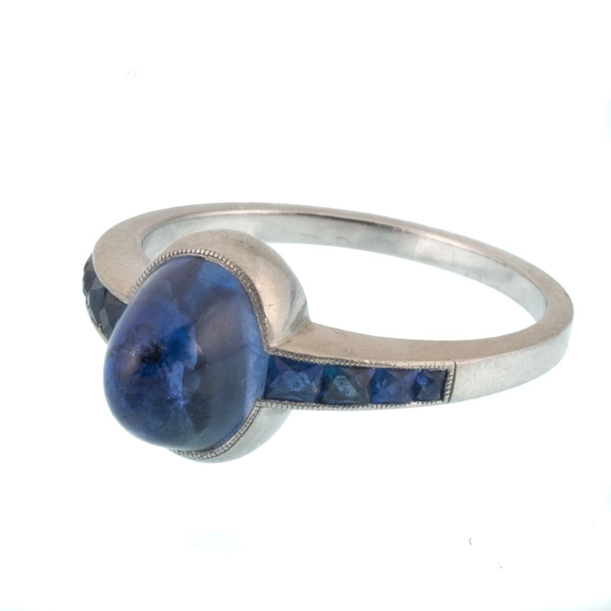 Art Deco Platinum and French Cut Sapphires Featuring a 1.3 Carat Cabochon Sapphire Ring For Sale