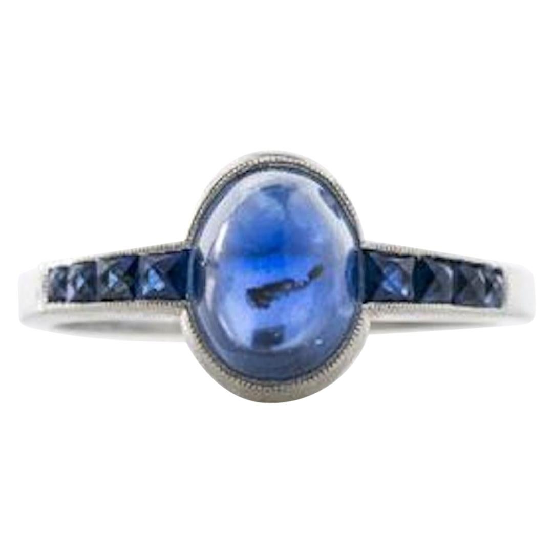 Platinum and French Cut Sapphires Featuring a 1.3 Carat Cabochon Sapphire Ring For Sale