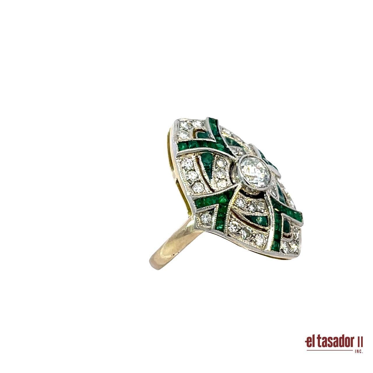 This bold and elegant ring is crafted in platinum and gold, weighing 8 grams, and features a captivating Art Deco-inspired design. At its center lies a brilliant-cut diamond, surrounded by a radiant display of additional brilliant-cut diamonds and