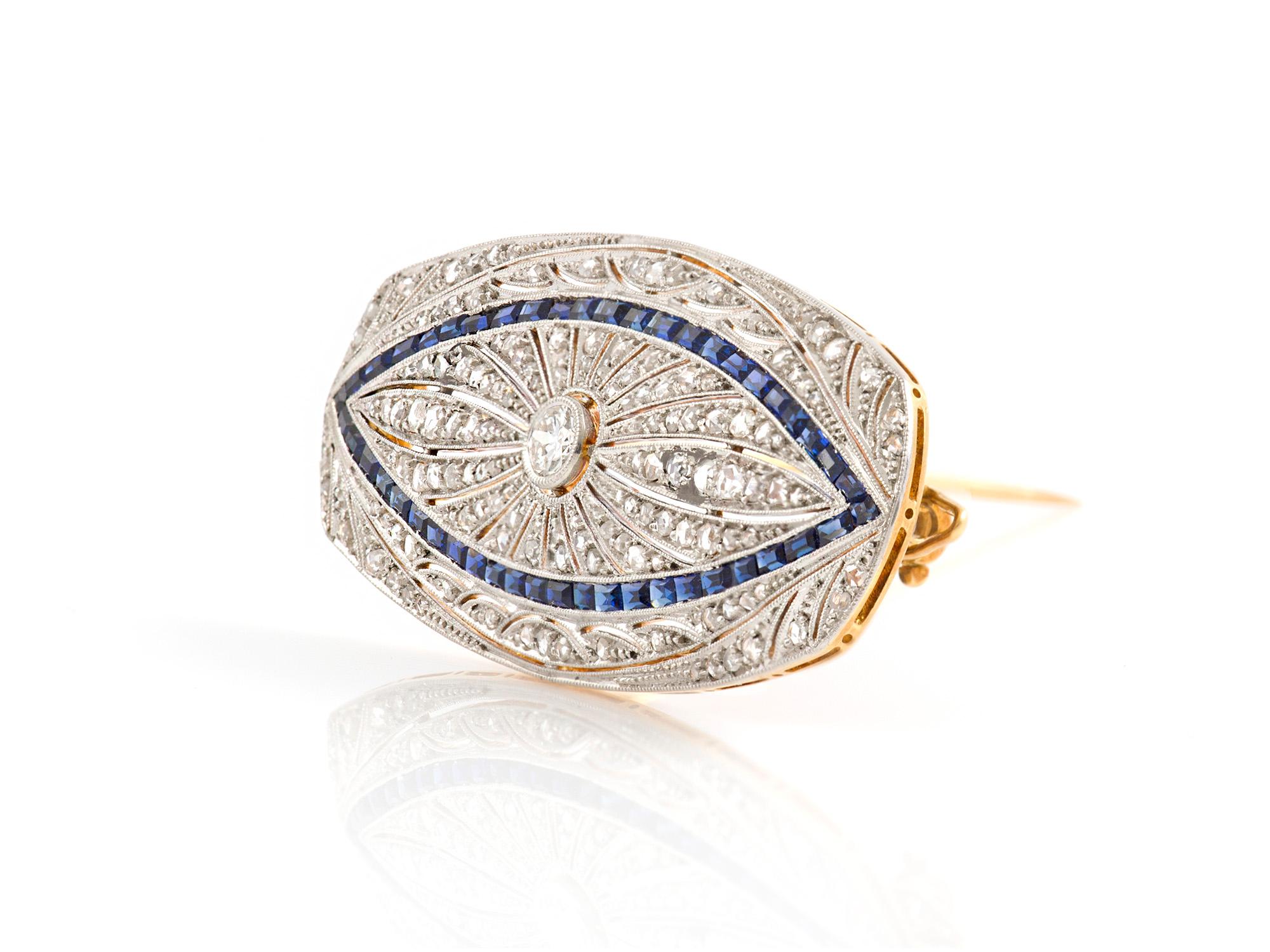 The brooch is finely crafted in 18k ywllow gold and platinum with sapphire and diamonds weighing approximately total of 2.50 carat.