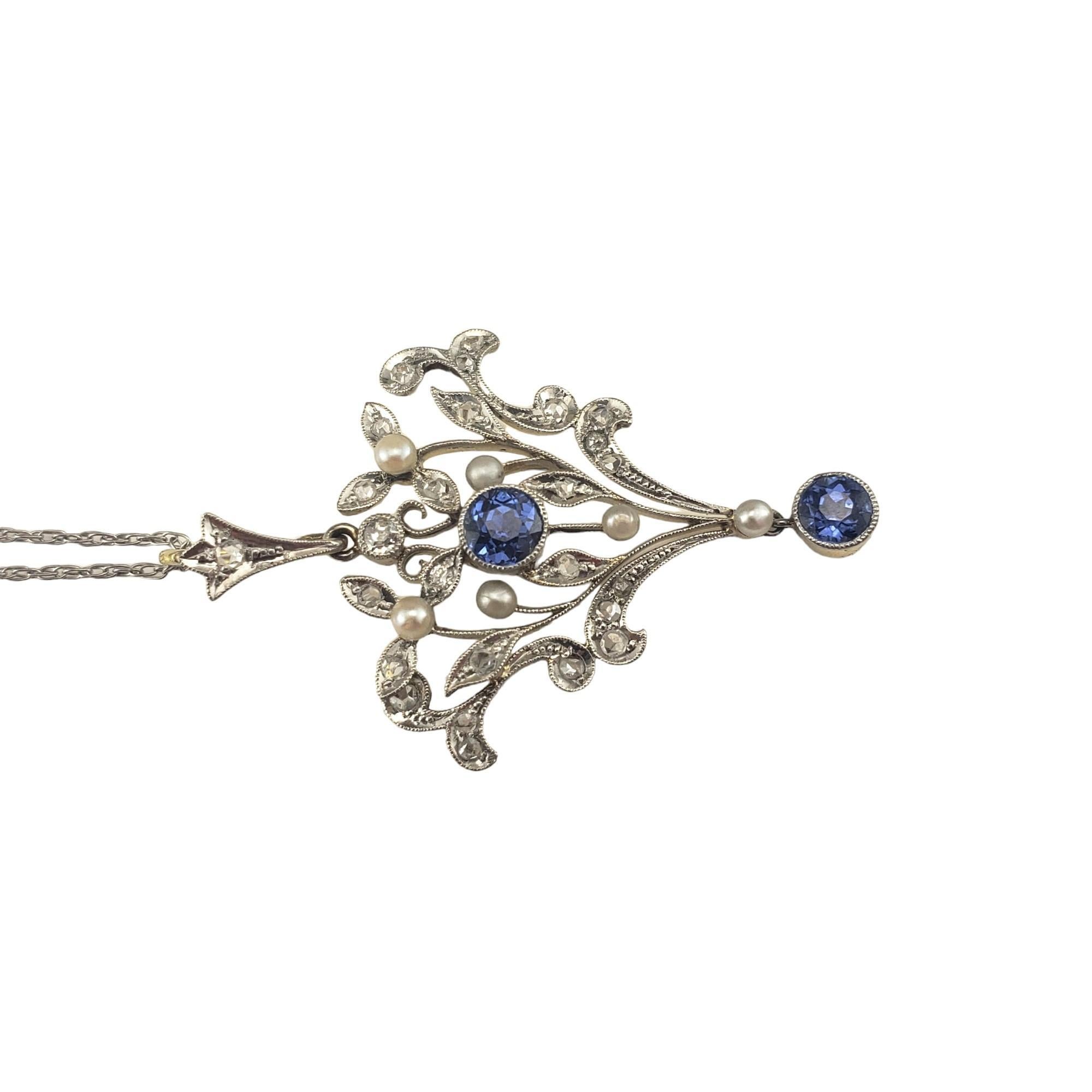 Vintage Platinum and Diamond Pendant Necklace-

This elegant pendant features two round blue sapphires (4 mm), 25 rose cut diamonds and five freshwater pearls set in beautifully detailed platinum.  Pendant is backed in 13K yellow gold which is