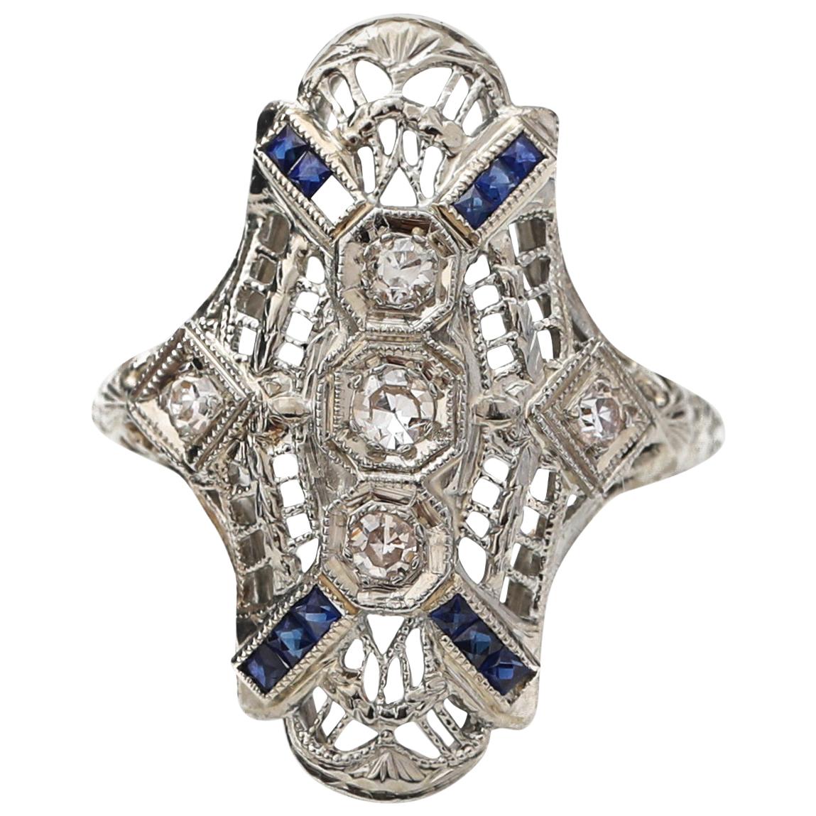 Platinum and Gold Shield Ring with Diamonds and Sapphires, circa 1920s