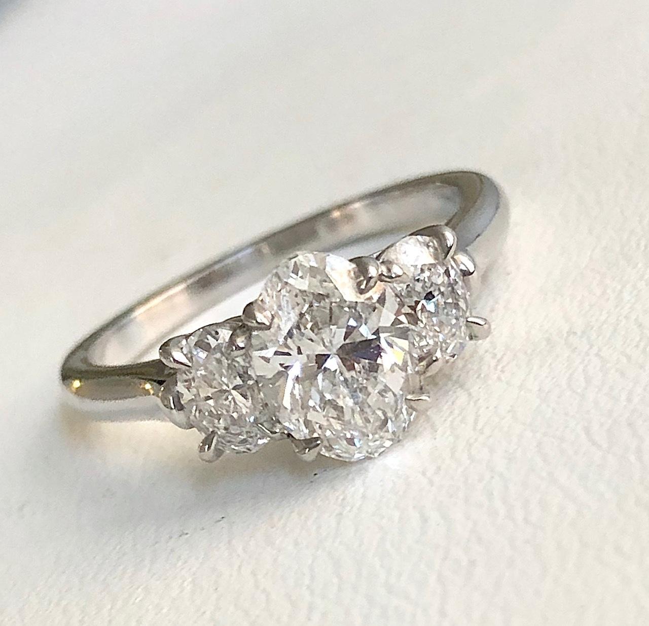 Our signature 3-stone Oval Diamond ring, handmade in Platinum, set with a center Oval diamond 1.20 carats,with a GIA report DVS2, and a pair of matching side Oval diamonds 0.58 carats.

We design and manufacture all our jewelry in our workshop,