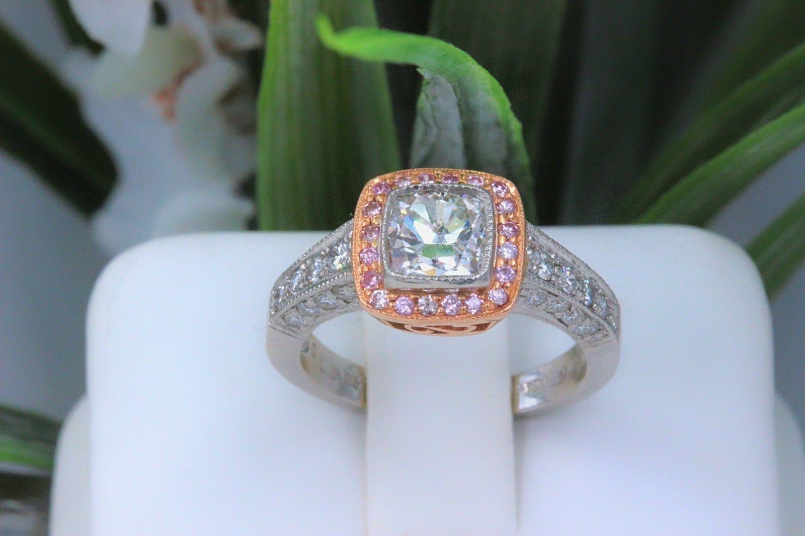 Rose Gold & Platinum Diamond Engagement Ring
Style:  Halo
Metal:  Platinum and 14k Rose Gold 
Size:  6.25 - sizable
Total Carat Weight:  1.50 tcw
Diamond Shape:  Cushion Cut Approximately 1.00 cts
Diamond Color & Clarity: I SI1
Accent Diamonds:  24