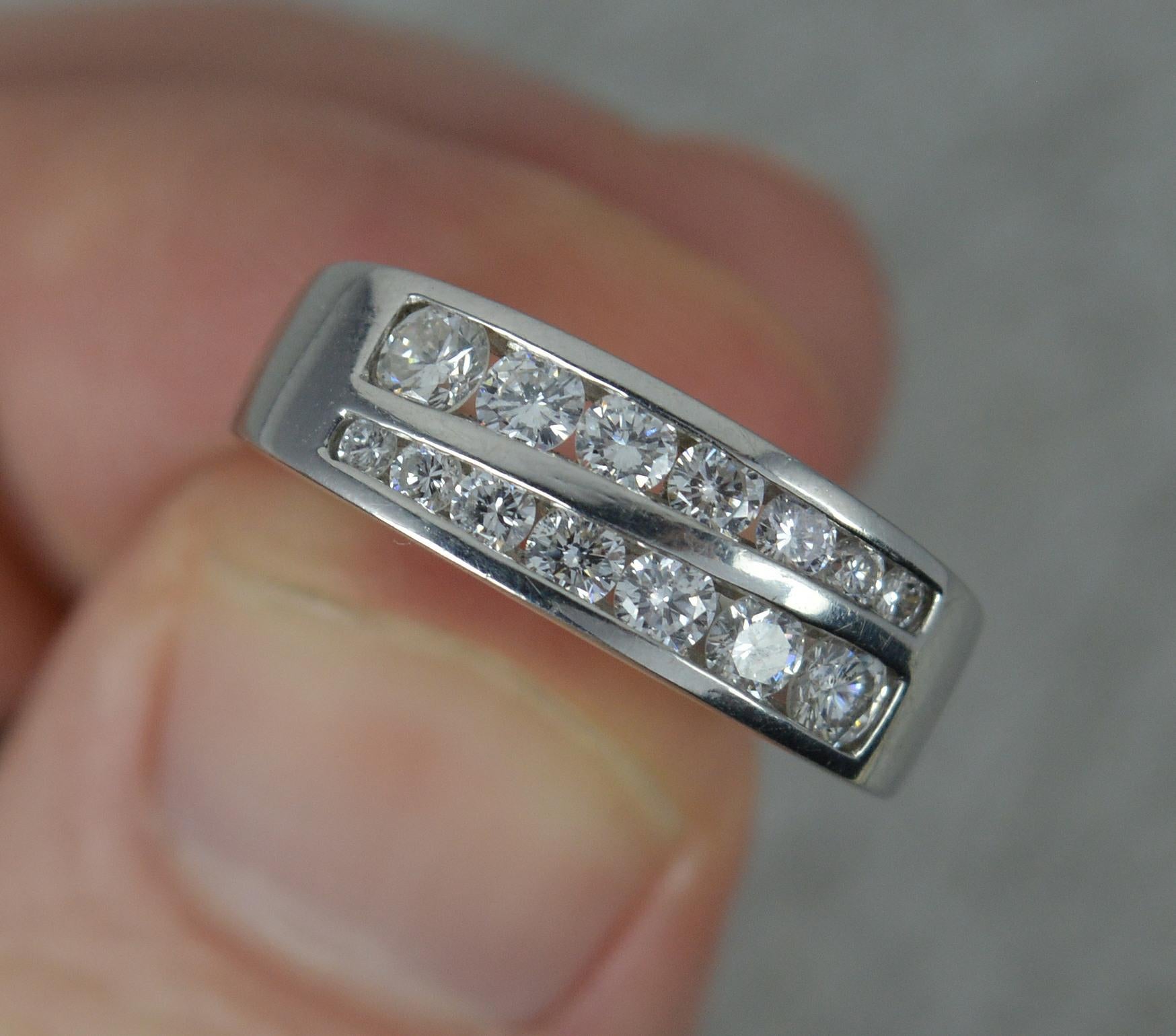 A Platinum and Diamond two row design stack ring.
​Designed with two rows of seven natural round brilliant cut diamonds. Graduated size to total 0.6 carats approx. Very clean, white and sparkly.
15mm spread of stones, 6.1mm wide band, protruding