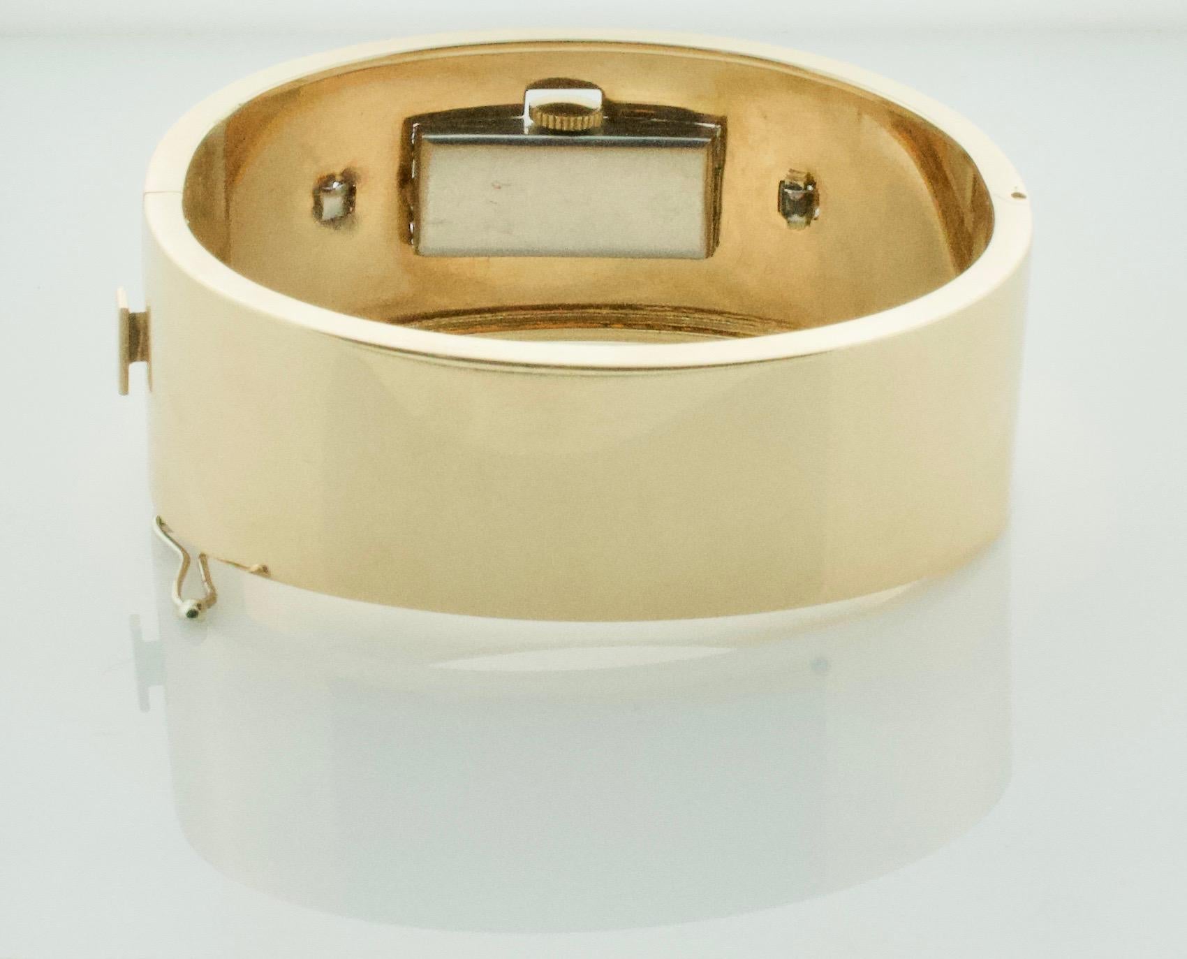 Platinum and Yellow Gold Bangle Bracelet with Art Deco Diamond and Ruby Watch  In Fair Condition For Sale In Wailea, HI