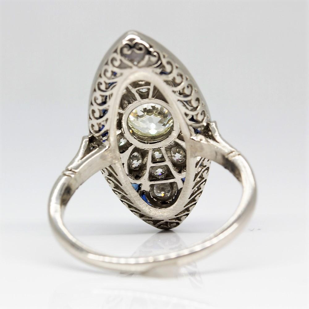 Art Deco Platinum Antique Diamond and Calibrated Cut Sapphires Ring