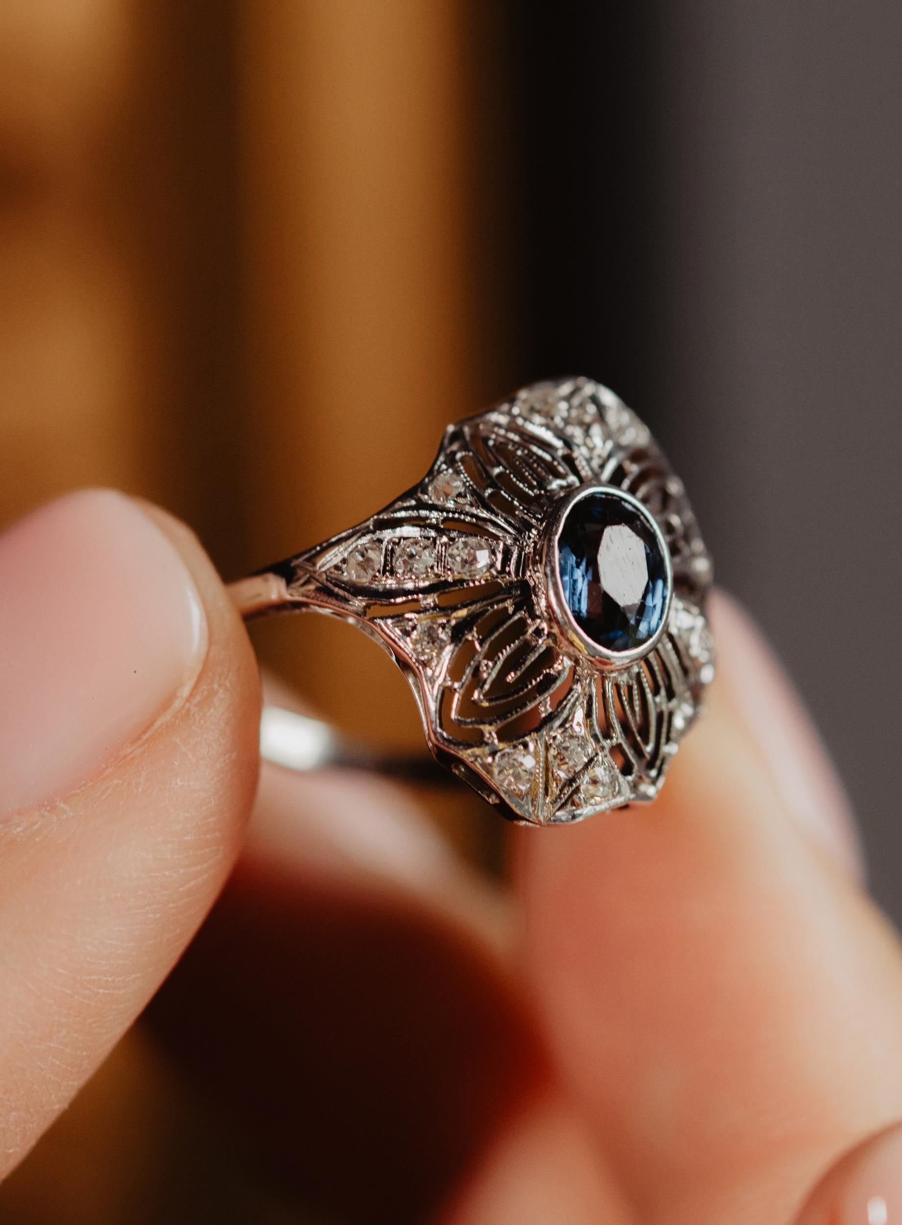 A stunning antique Edwardian era platinum ring set with a natural untreated sapphire and sparkling diamonds! This classy and heavy ring dates to the early 1900's and comes from the Central Europe.

A typical example of Edwardian era delicate
