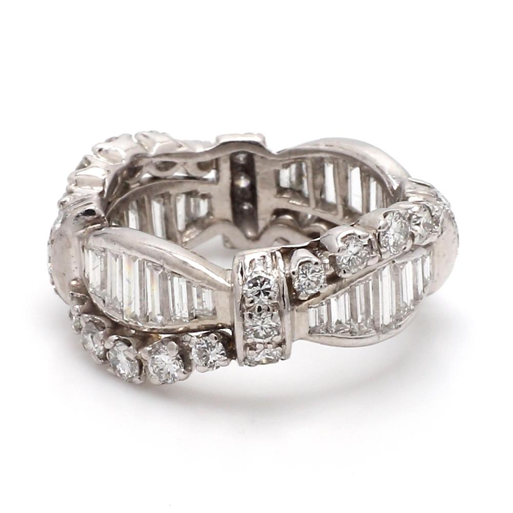 Platinum, diamond eternity band. Band is set with twenty-eight (28) straight baguette cut diamonds and thirty-two (32) round brilliant cut diamonds weighing 3.00ctw. Band weighs 8.3 grams and is a size 6. 
All questions answered. 
All reasonable