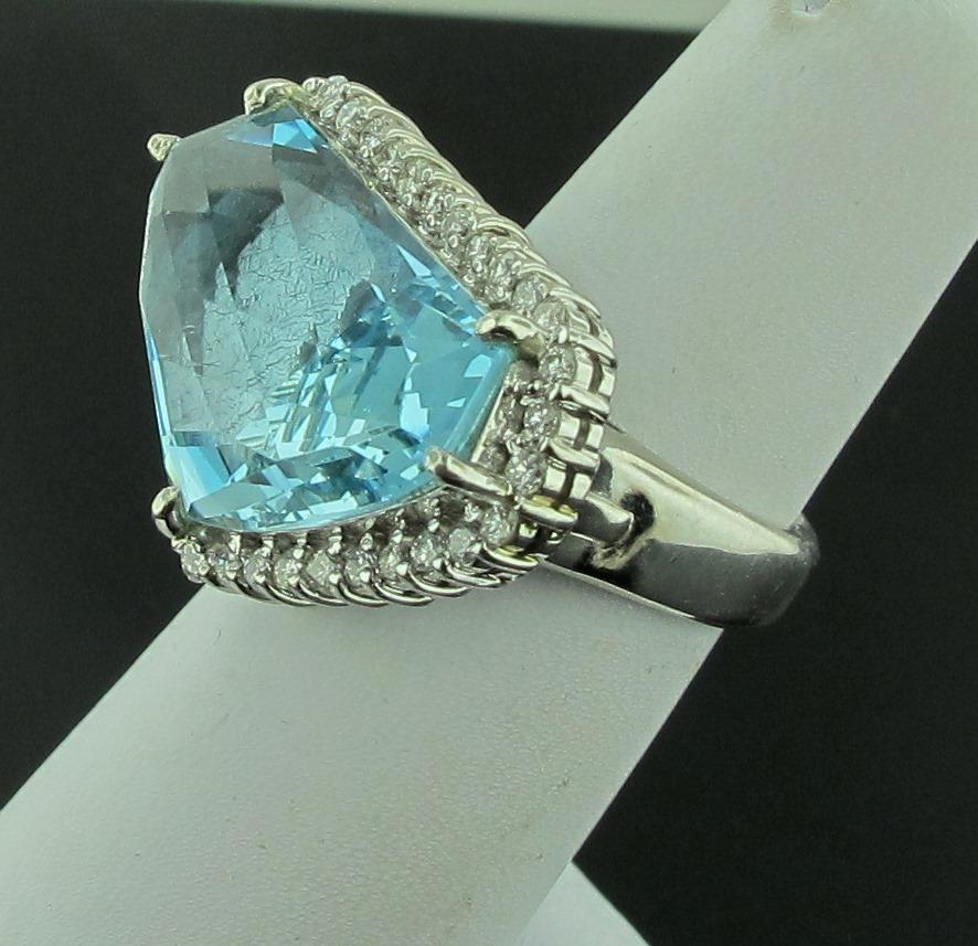 Set in Platinum is a 14.49 carat octagonal shaped Aquamarine surrounded with 36 round brilliant cut diamonds for a total diamond weight of 0.66 carats.  Color is G-H, Clarity is SI.  Ring size is 6.  Weight is 21 grams.