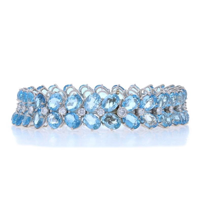 Brand: Julius Cohen
Era: Vintage

Metal Content: Platinum & 18k White Gold

Metal Note: (platinum bracelet with 18k gold clasp)

Stone Information

Natural Aquamarines
Treatment: Heating
Carat(s): 38.40ctw
Cut: Oval
Color: Blue

Natural