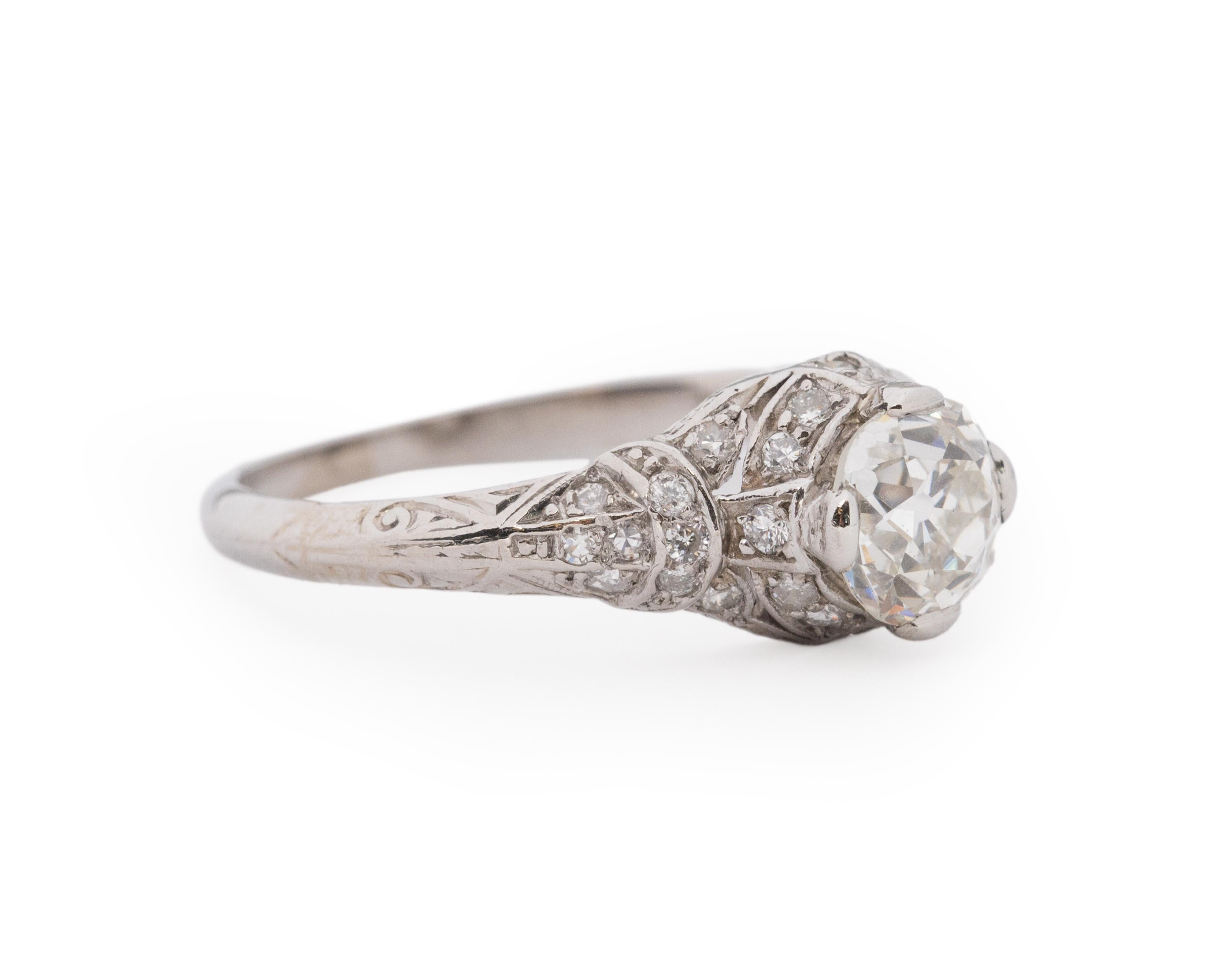 Year: 1920s

Item Details:
Ring Size: 6.75
Metal Type: Platinum [Hallmarked, and Tested]
Weight: 3.5 grams

Center Diamond Details:

GIA Report#: 2239213453
Weight: 1.01ct total weight
Cut: Old European brilliant
Color: J
Clarity: VS1
Type: