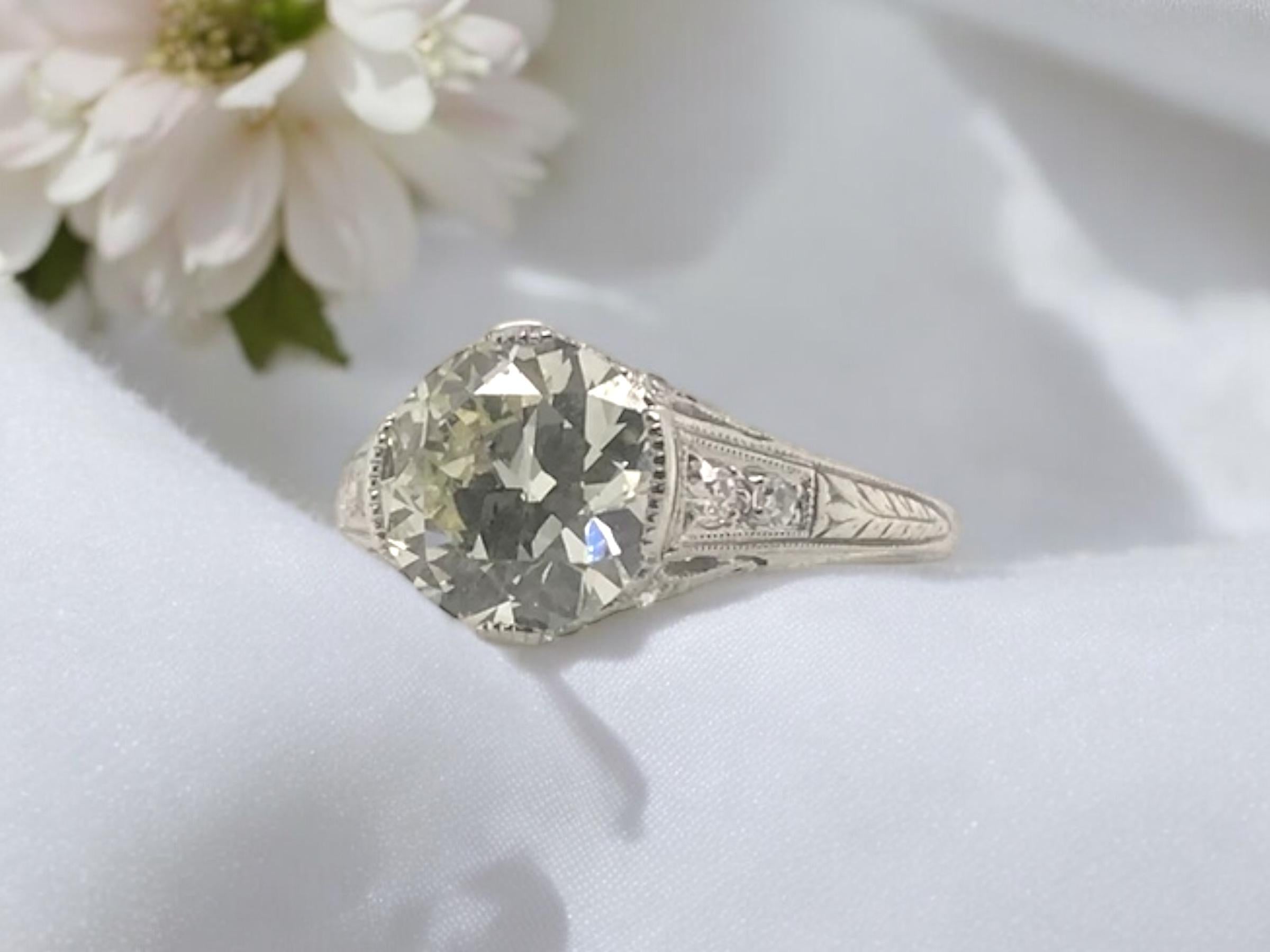 This beauty is one of our current favorites!!
She exhibits true craftsmanship.
A perfectly detailed filigree solitaire engagement ring.

Ring Details
Material: Platinum
Era: Art Deco 1920 - 1940
Head Width: 9.6mm
Head Height: 5mm
Shank Width: