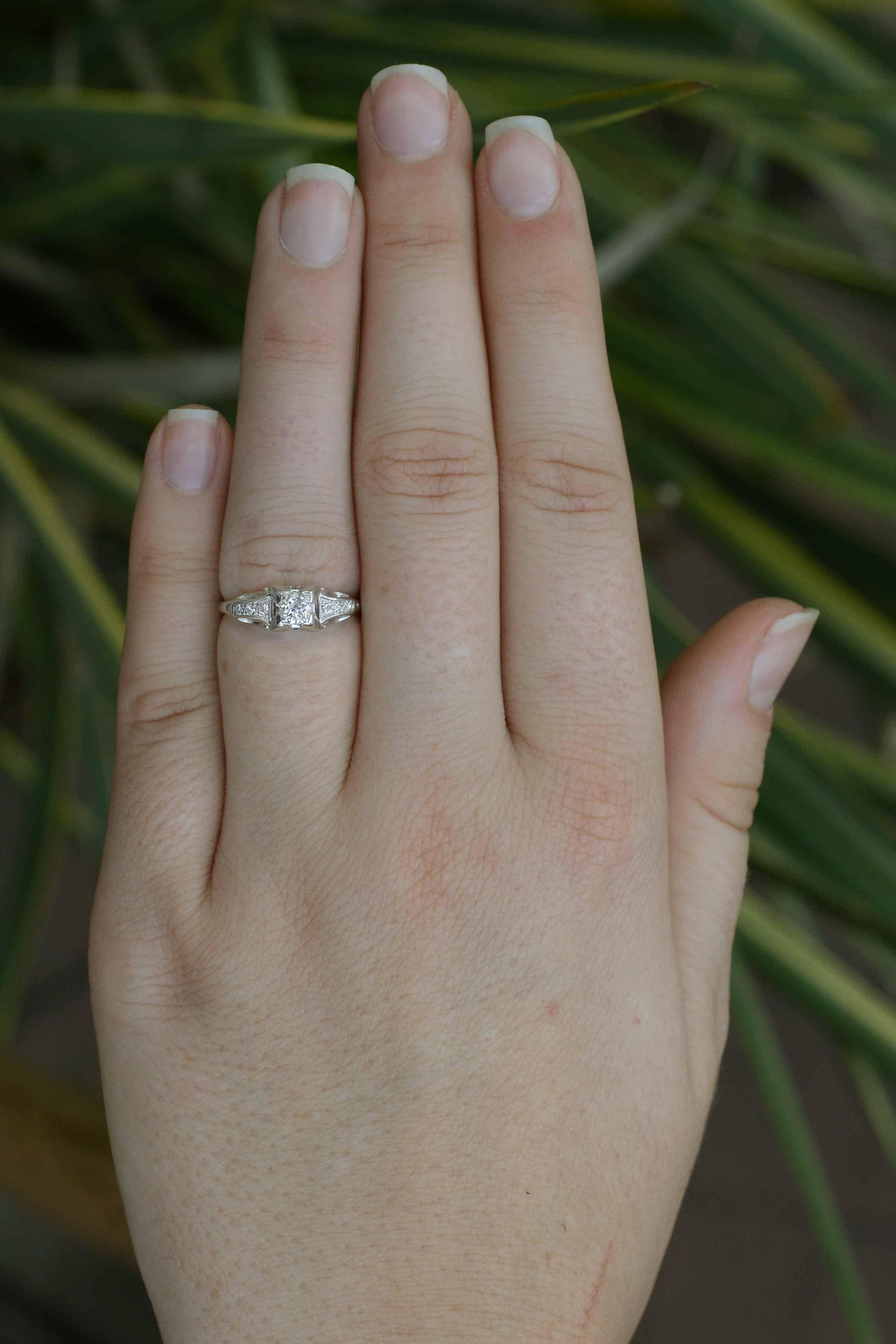 On the hunt for an affordable vintage engagement ring? Look no further. You will feel so elegant wearing this classic 100 year old ring! From it's captivating wide fluted prong setting, a faceted 1/4 carat near-colorless old European diamond glints