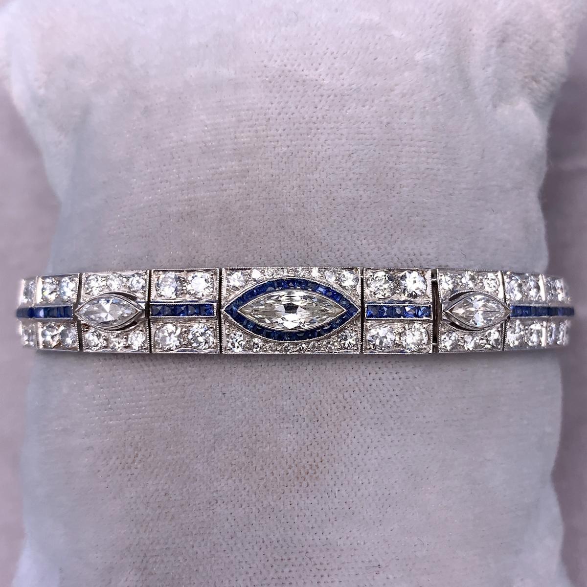 Platinum Art Deco 8.5ct Diamond Bracelet with Synthetic Sapphires (#J4561)

Antique platinum Art Deco diamond bracelet featuring 8.5 carats of diamonds accented by calibre cut synthetic blue sapphires. There are a total of 124 diamonds including 3
