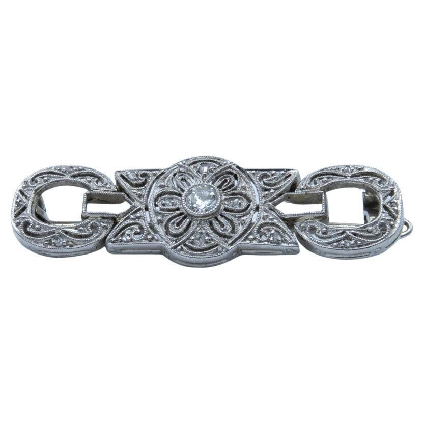 Broche Art déco en platine et or, sertie de 14 diamants, début du XXe siècle