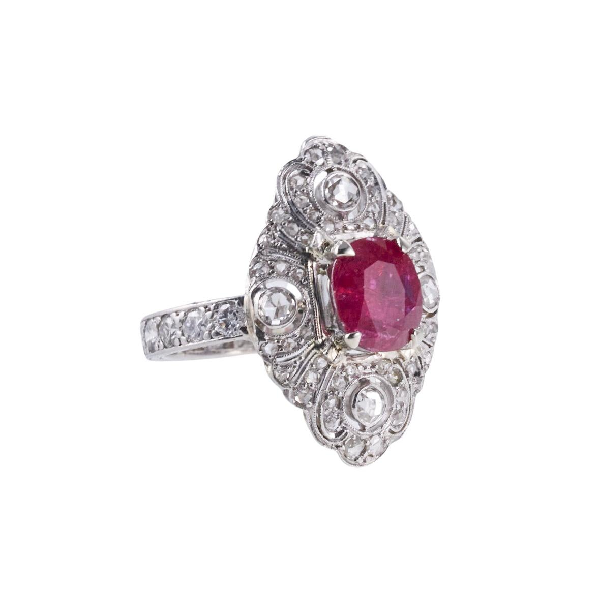 Platinum cocktail ring, set with center C. Dunaigre of Switzerland certified 1.50ct no heat Thailand ruby. Stone measures approx. 7.85 x 6.45 x 3.35mm. Surrounded with a total of approximately 1.40ctw in H-I/SI diamonds. Ring size 6.5, top is 22mm x