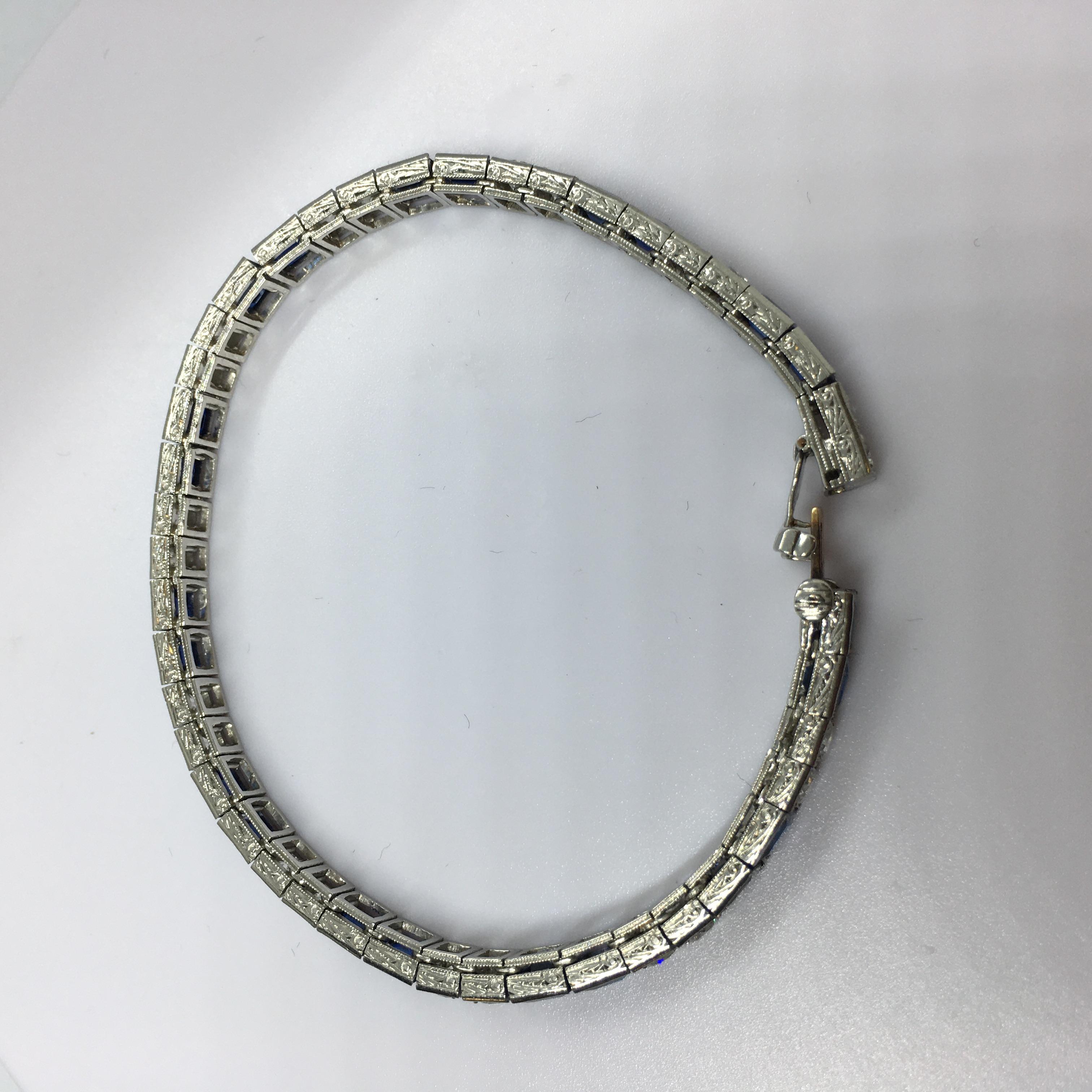 Platinum Art Deco Circa 1920s Tiffany & Co Natural Sapphire Diamond Bracelet

5mm wide
25.9 gram Platinum, tested
7 1/8 inch long
Total of 44 links 22 Sapphire and 22 Diamond
Old European Cut Diamonds 4 mm round, prong set, E-F color VS1 clarity or