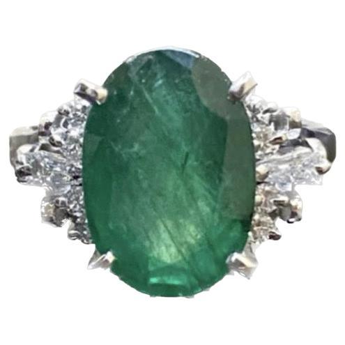 Platinum Art Deco Diamond 4.56 Carat Oval Emerald Engagement Ring For Sale