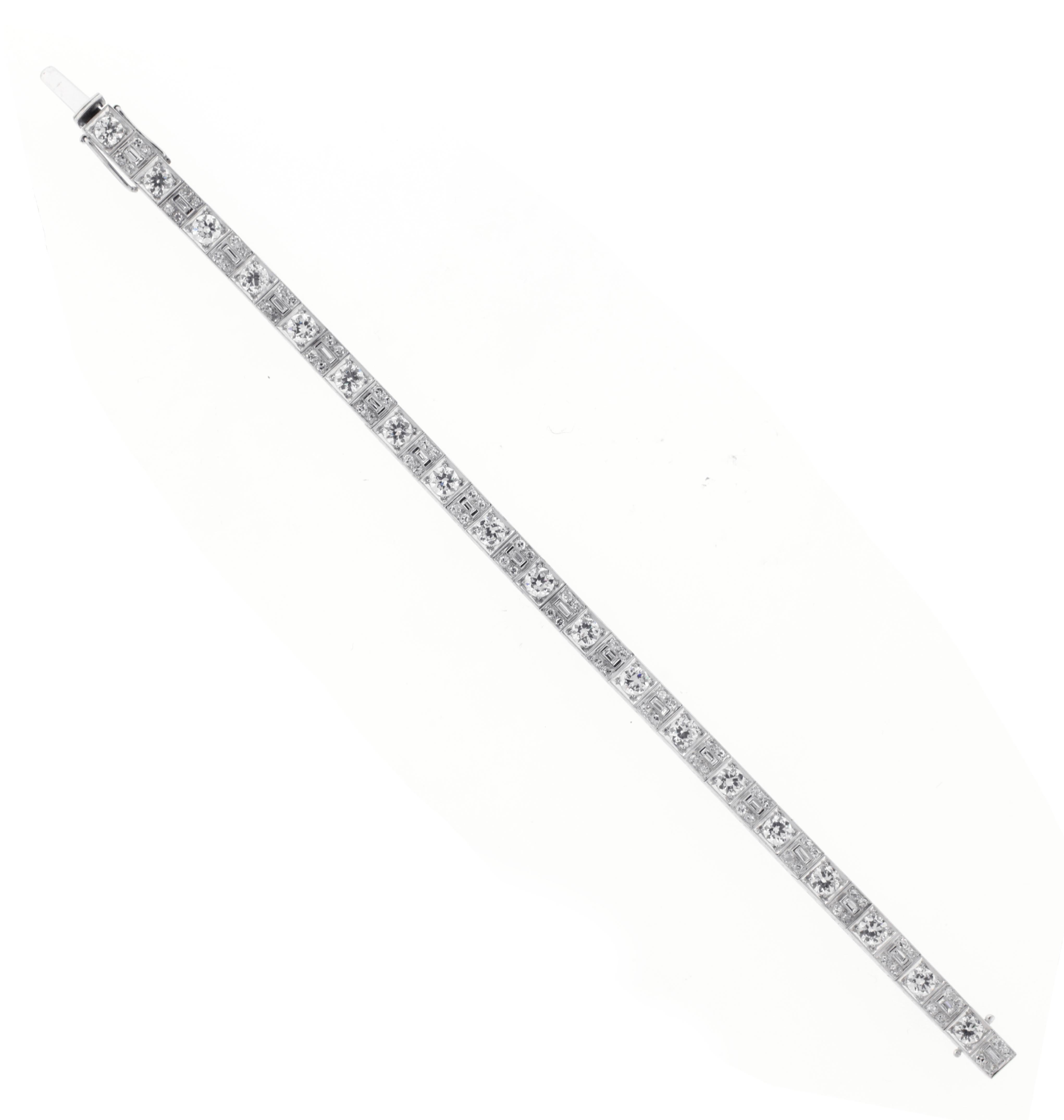 This stunning platinum bracelet features 19 old European cut diamonds with a total weight of approximately 4.75 carats, complemented by 95 smaller diamonds weighing 1.75 carats. The diamonds are graded G-H in color and VS in clarity. The bracelet