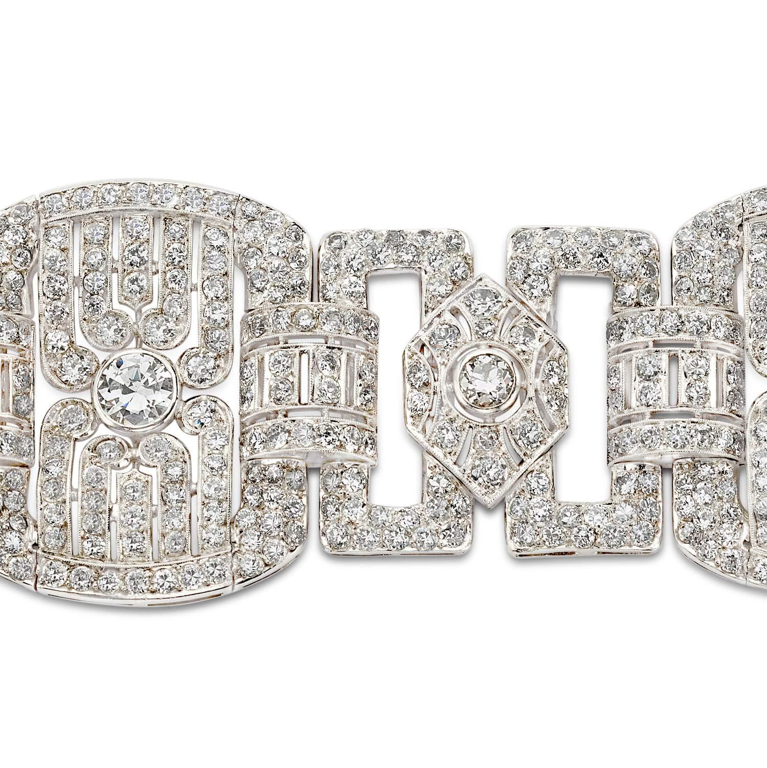 This Art Deco Bracelet Has 37.5 CTW Of Diamonds. The Bracelet Has 672 Round Pave Diamonds 33.00 CTS, 3 Round Diamonds 1.50 CTS  On The Smaller Stations And 3 Round Diamonds 3.00 CTS On The Larger Sections.