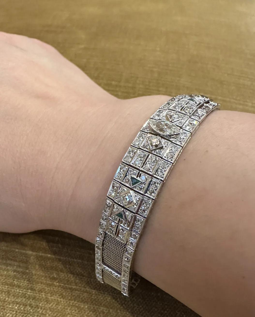Platinum Art Deco Diamond Bracelet with Marquise Center 

Platinum Art Deco Diamond Bracelet features One Marquise Diamond and Two Square Cut Diamonds in center accented by 190 Old Cut Round and Single Cut Diamonds as well as Ten Square and Trillion