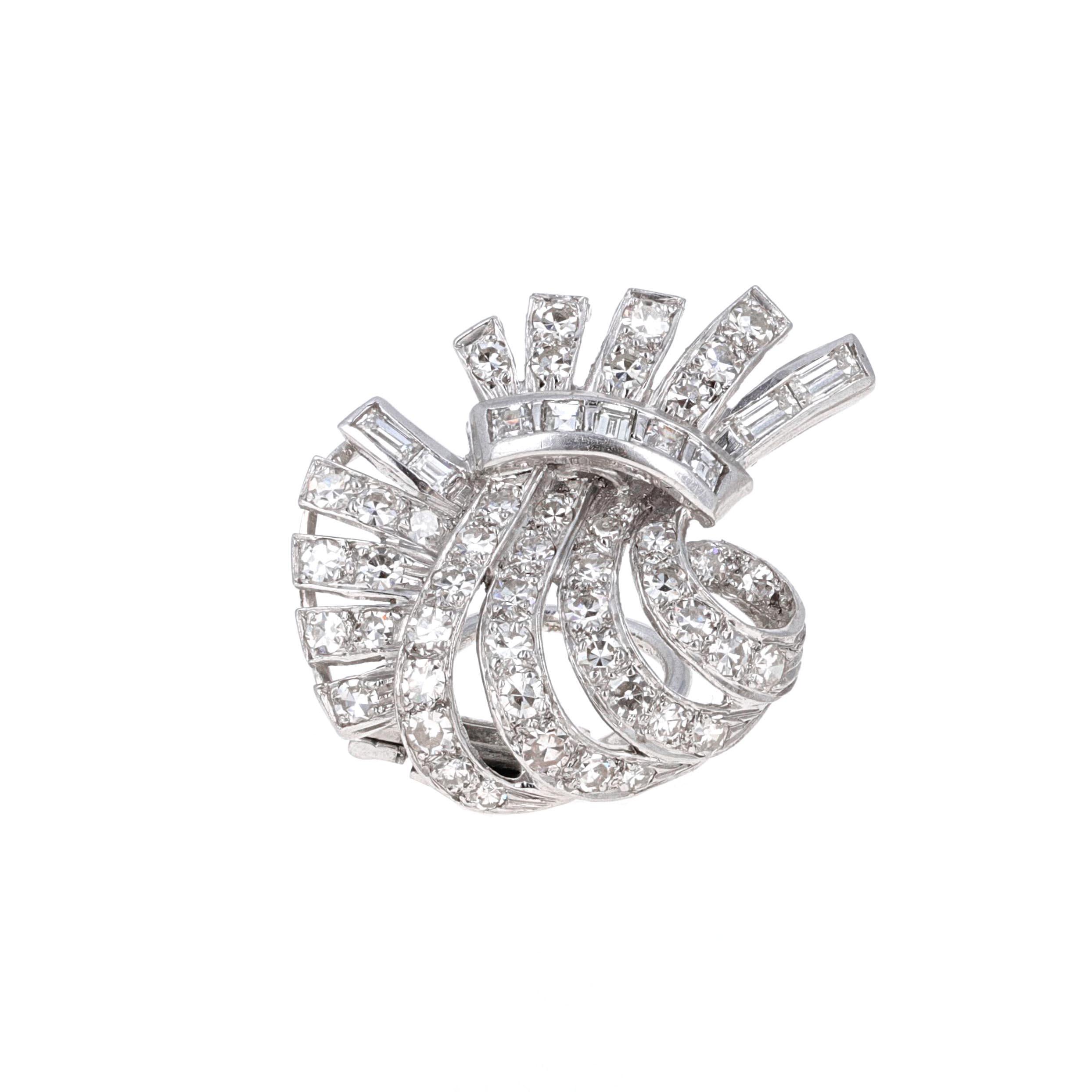 Platinum art deco lever-back diamond earrings. The earrings are clip-on and have a lever back. They are beautifully made with old European cut diamonds and baguette diamonds. The diamonds are white in color and eye-clean.
