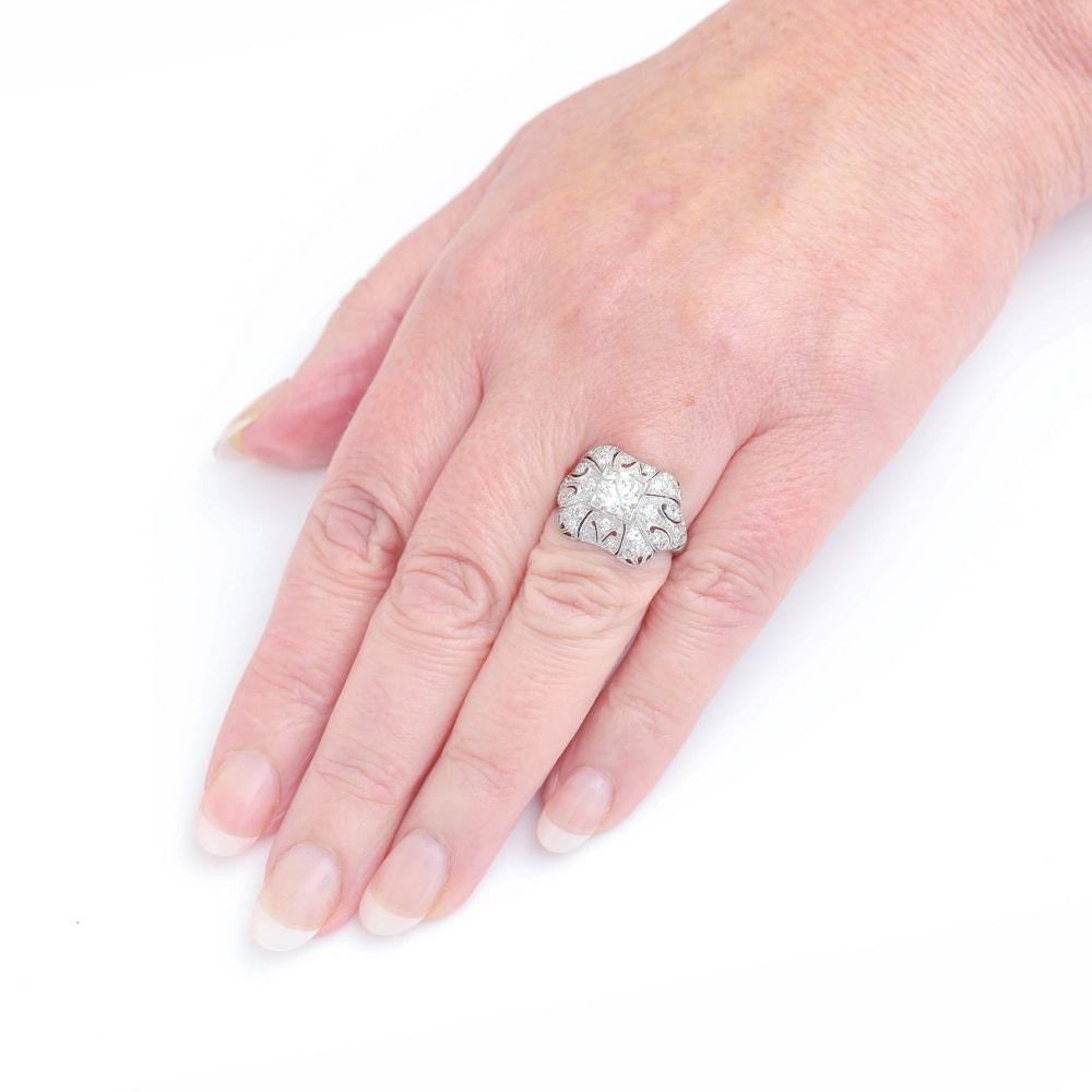 A super original Art Deco platinum diamond (est. 0.98ct transitional cut centre stone) with a further approx. 1.00ct of eight cut diamonds set within this beautiful pierced mille-grain setting. The setting is hand pierced, displaying such a fine