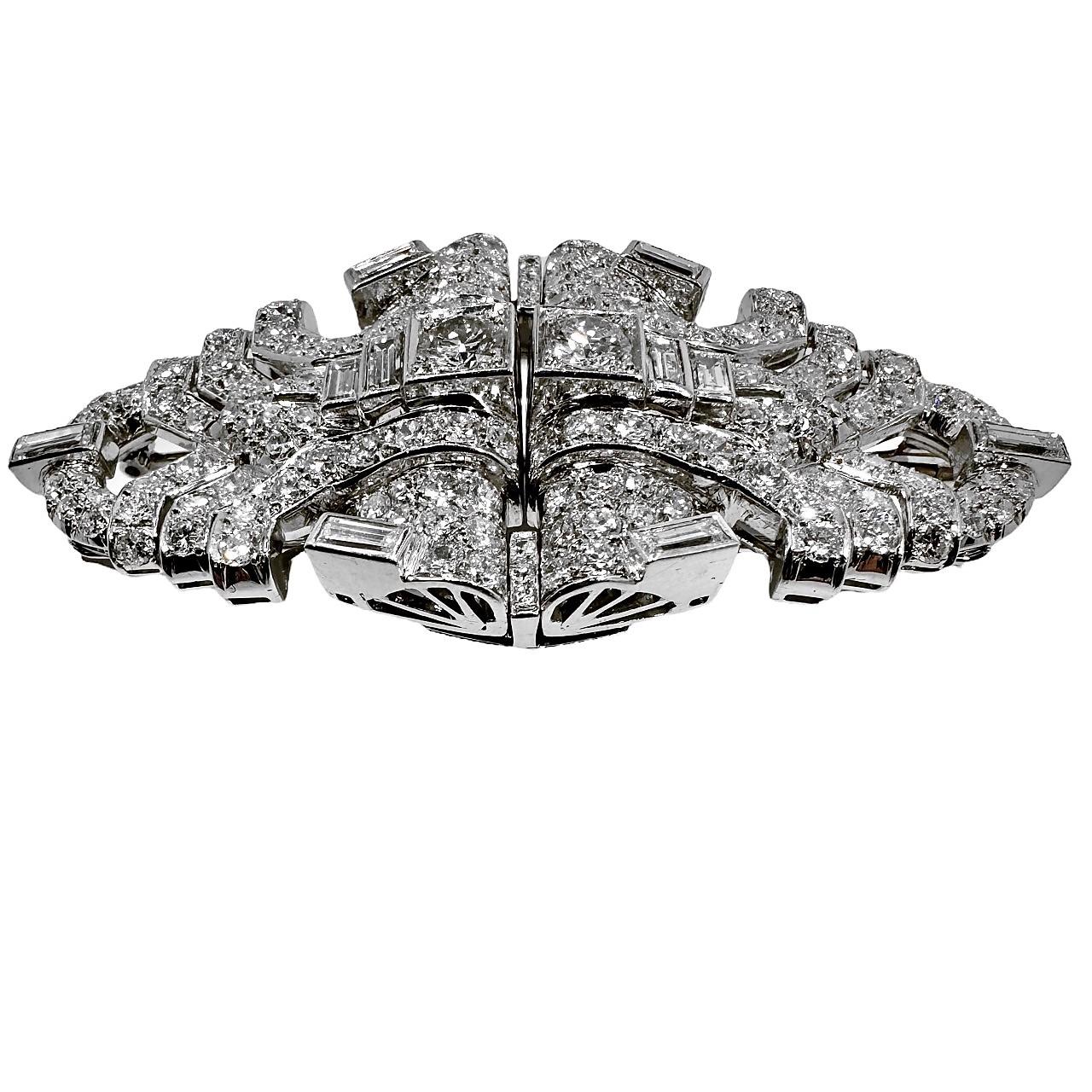 This striking and exquisitely designed pair of original Art-Deco period platinum and diamond double clips are very substantial in size, measuring almost 2 3/4 inches, left to right and 1 5/16 inches from top to bottom of the design area. They are