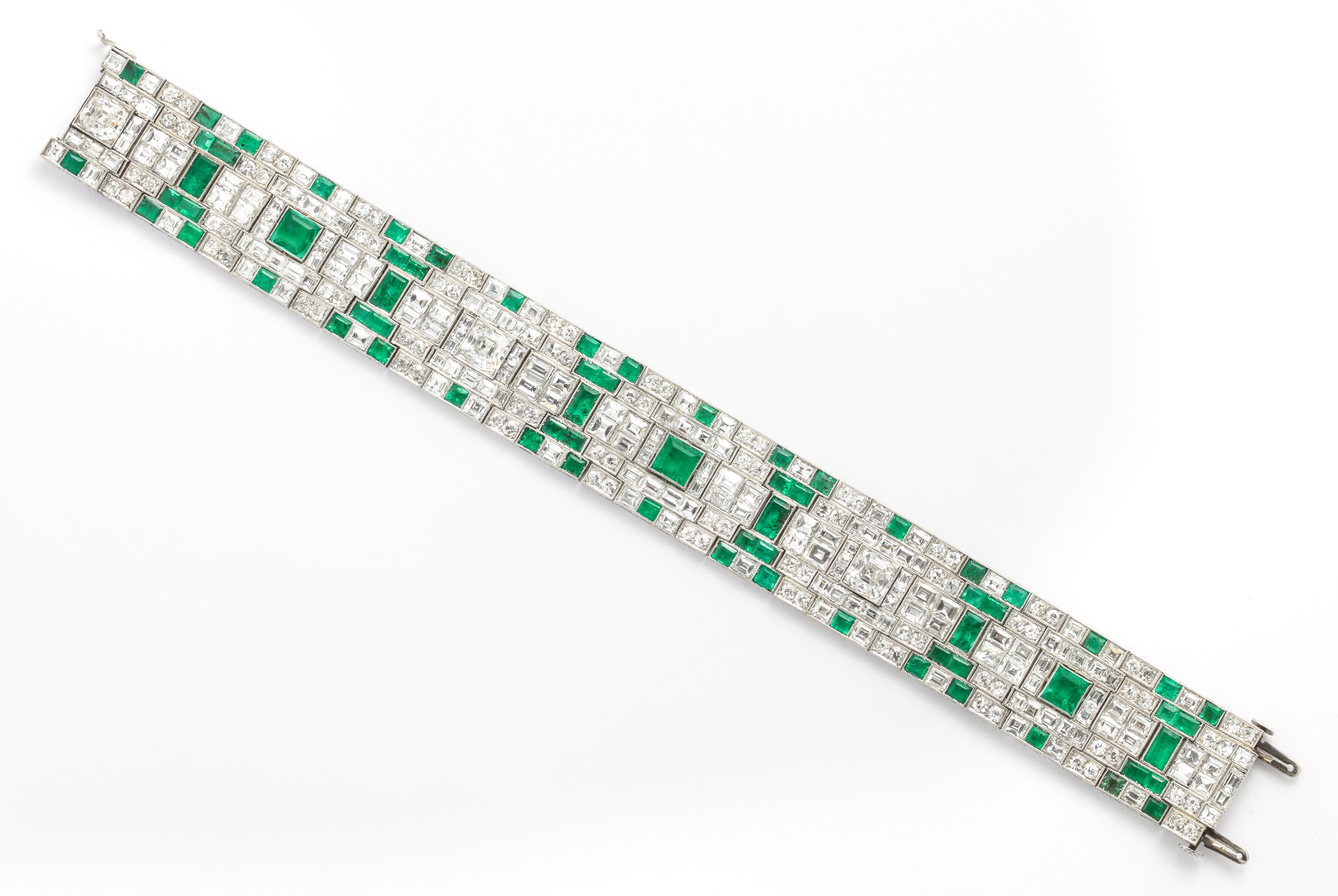 Unusual for it's interesting pattern and use of square cut emeralds, this art deco era bracelet is just the right width for wearing alone or stacking.  The composition pairs bright green square and baguette cut emeralds, most likely of Colombian