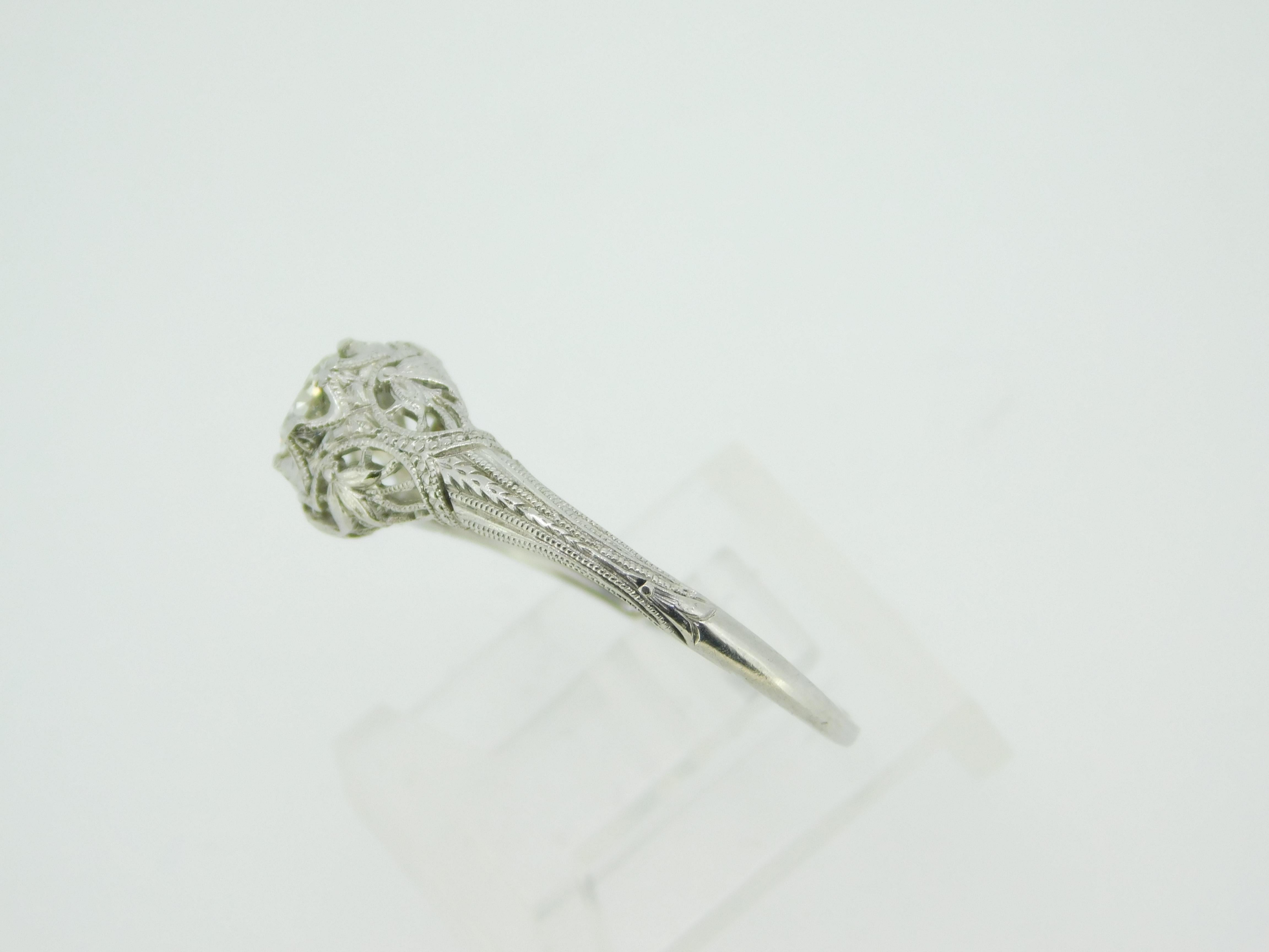 Platinum Art Deco Filigree .37ct Genuine Natural Diamond Ring Size 8 (#J4249)

Platinum Art Deco diamond filigree ring. The diamond is round brilliant cut weighing .37cts and measuring approximately 5.5mm. The diamond has VS clarity and I-J color.