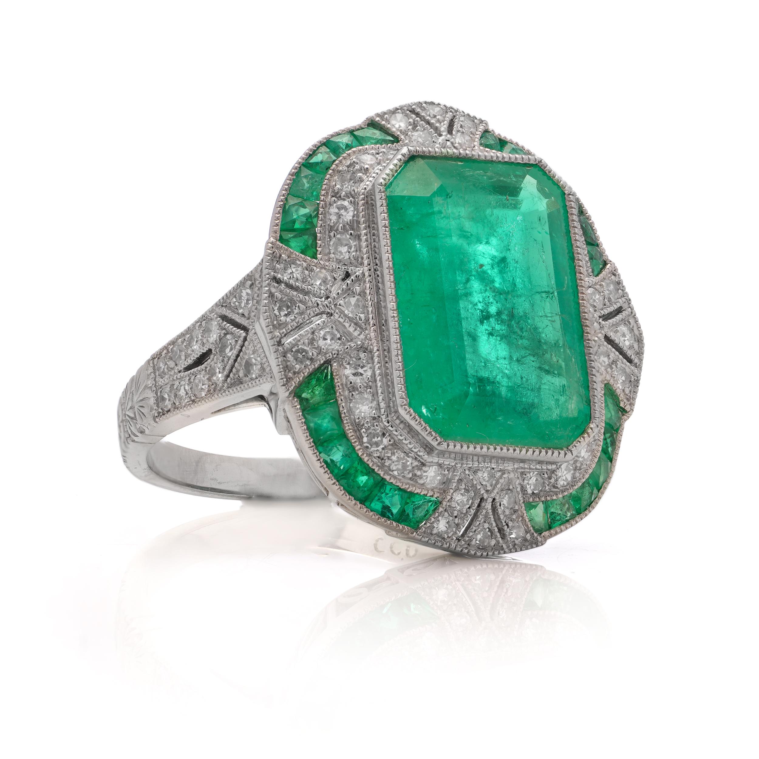 Platinum Art Deco-inspired 4.21 carats of Emerald fashion ring, surrounded by 0.66 carats of round brilliant cut diamonds.

Made in After 2000
Maker: JoAq
The ring tested positive for .850 platinum purity.

Dimensions -
Ring Size (UK) = N 1/2 (EU) =