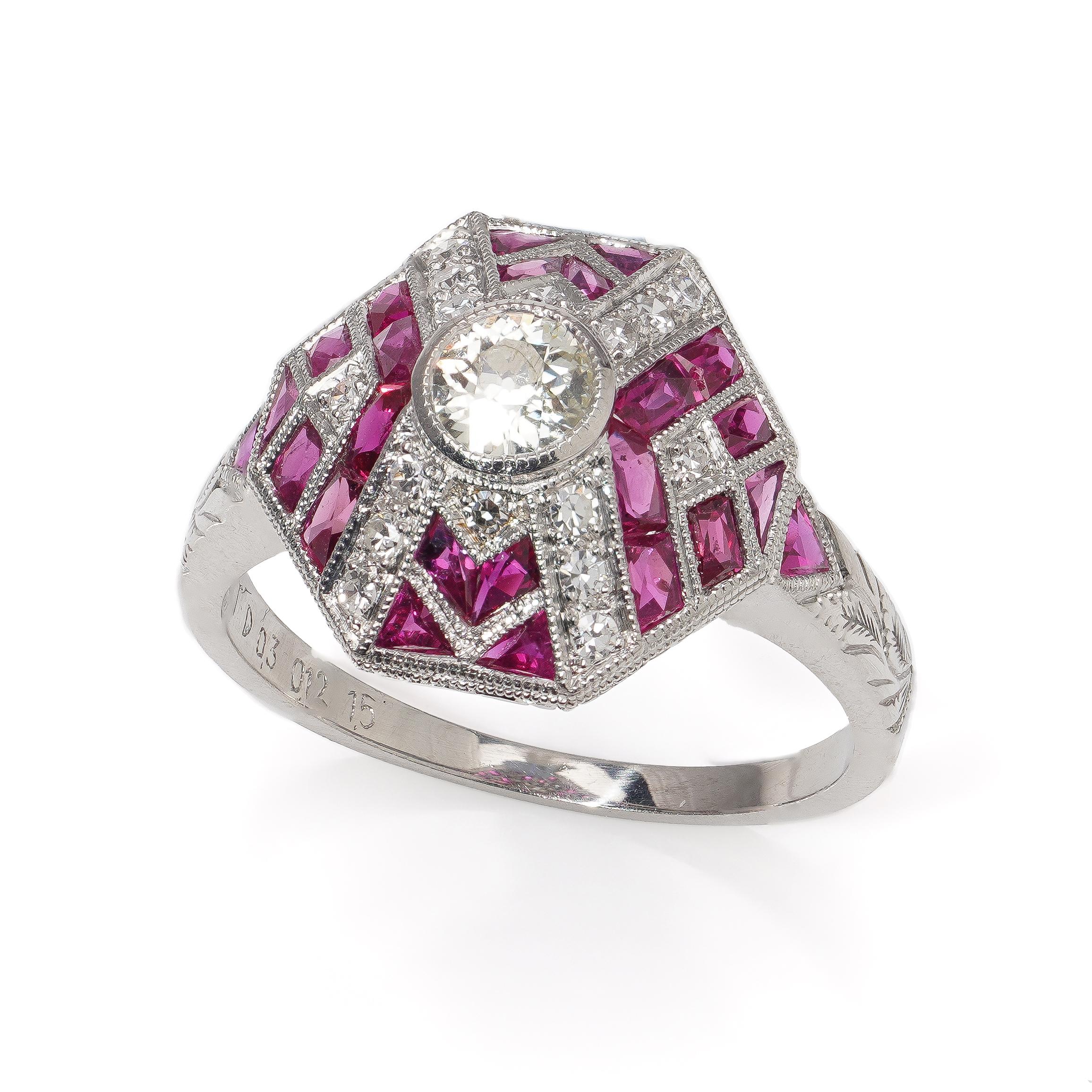 Platinum Art Deco-inspired diamond and ruby ring. 
Ring made in 1980s 
Makers Mark: JoAq 
Hallmarked PLAT 950 - D 0.3 - 0.12 - 1.50 

Dimensions - 
Finger Size (UK) = N (US) = 7 (EU) = 54 
Weight : 5.87 grams 
Size : 2.7 x 2.1 x 1.4 cm 

Diamonds -