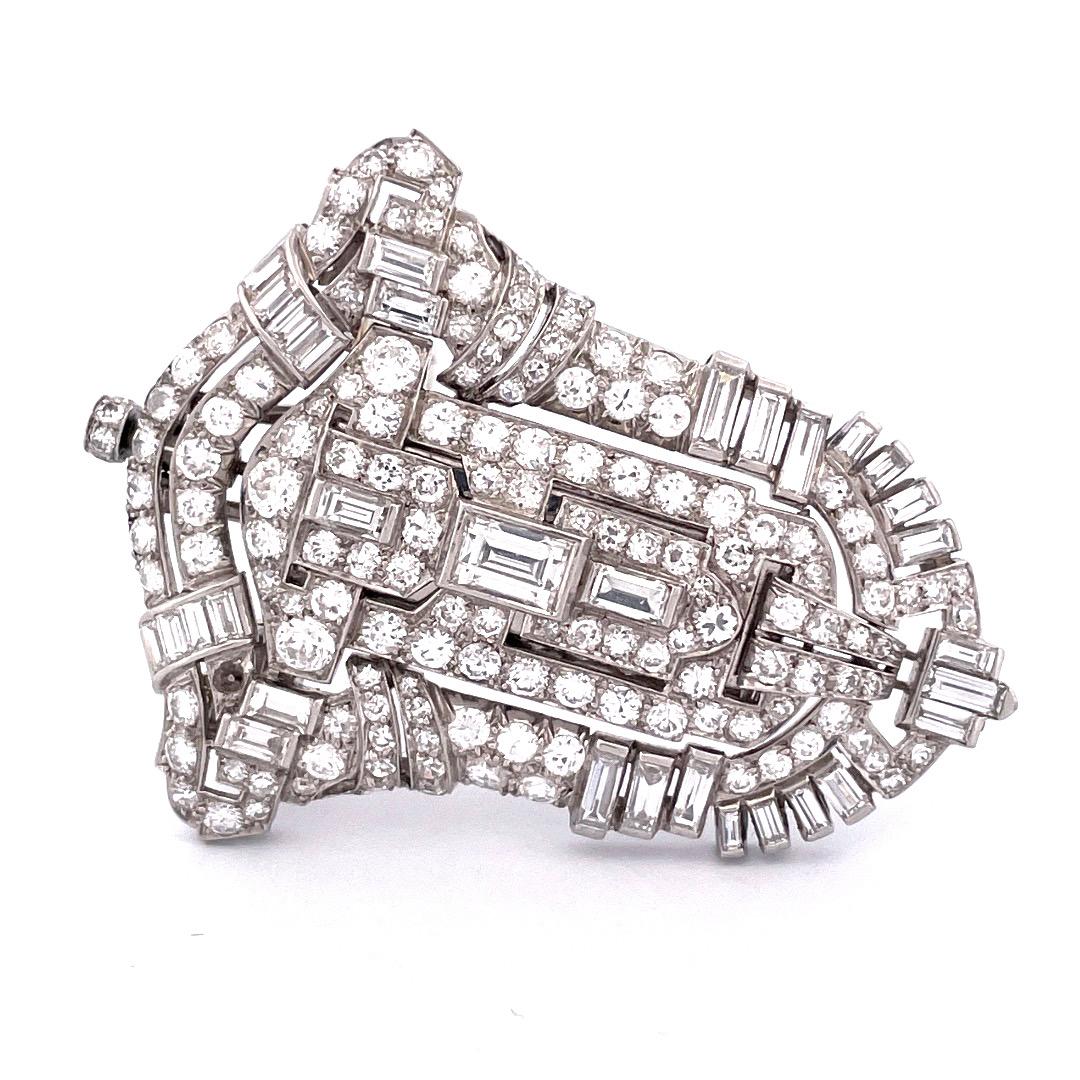 Platinum Art Deco Pendant, Watch, and Brooch with 6.50 TCW Mixed Cut Diamonds

Indulge in the epitome of luxury with our extraordinary Platinum Art Deco Pendant, Watch, and Brooch ensemble. This remarkable piece features a captivating blend of mixed