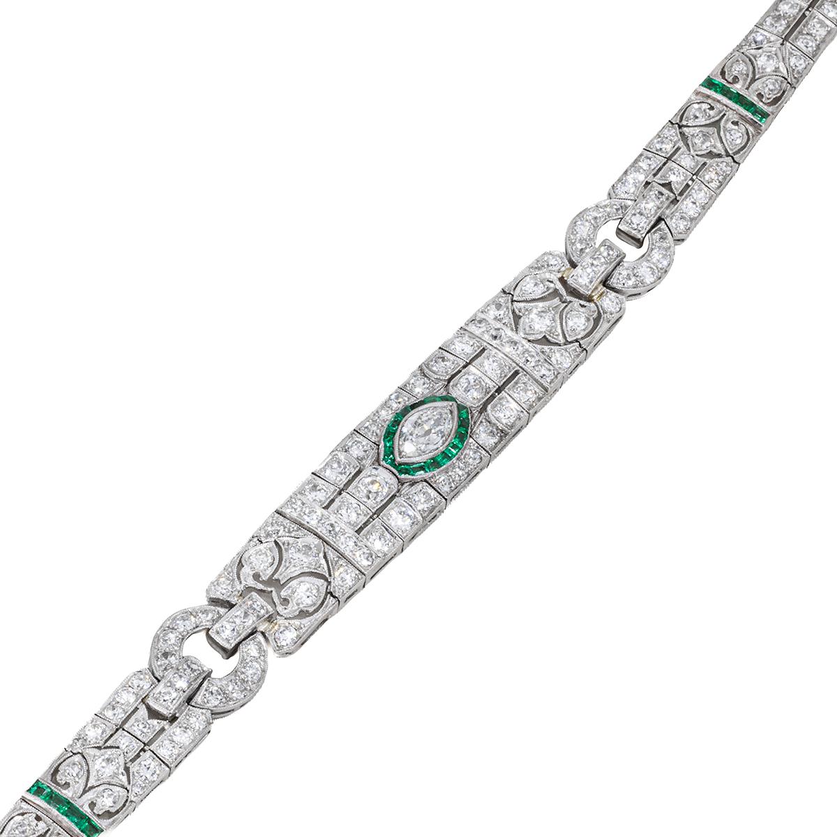 Platinum Art Deco period Bracelet with 1 marquis cut diamonds weighing approximately 0.75 carats surrounded by emeralds and 130 old european cut diamonds weighing approximately 8.00 carats 25.19 grams