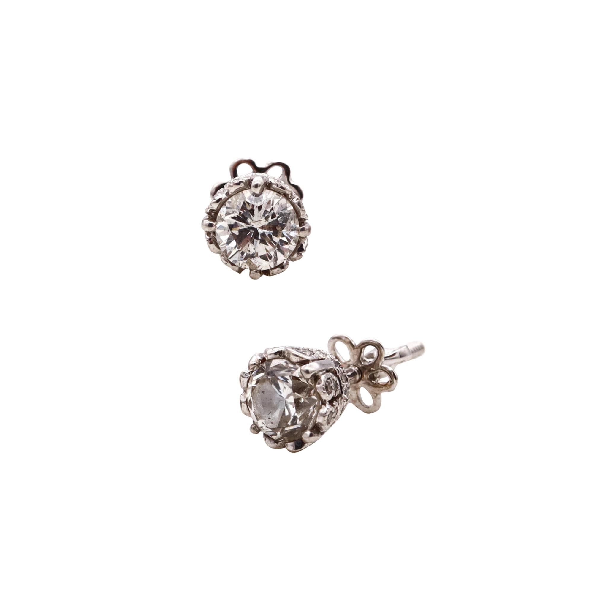 Pair of studs earrings with diamonds.

A modern recreation made in Germany from the art deco period, circa 1930's. These studs earrings has been carefully crafted in solid .950/.999 platinum and are suited with screw backs for pierced ears and a