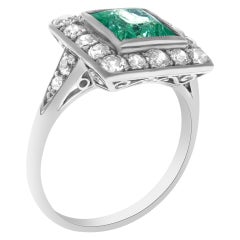 Platinum Art Deco ring with diamonds and peridot stone.