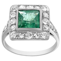 Platinum Art Deco ring with diamonds and peridot stone. 
