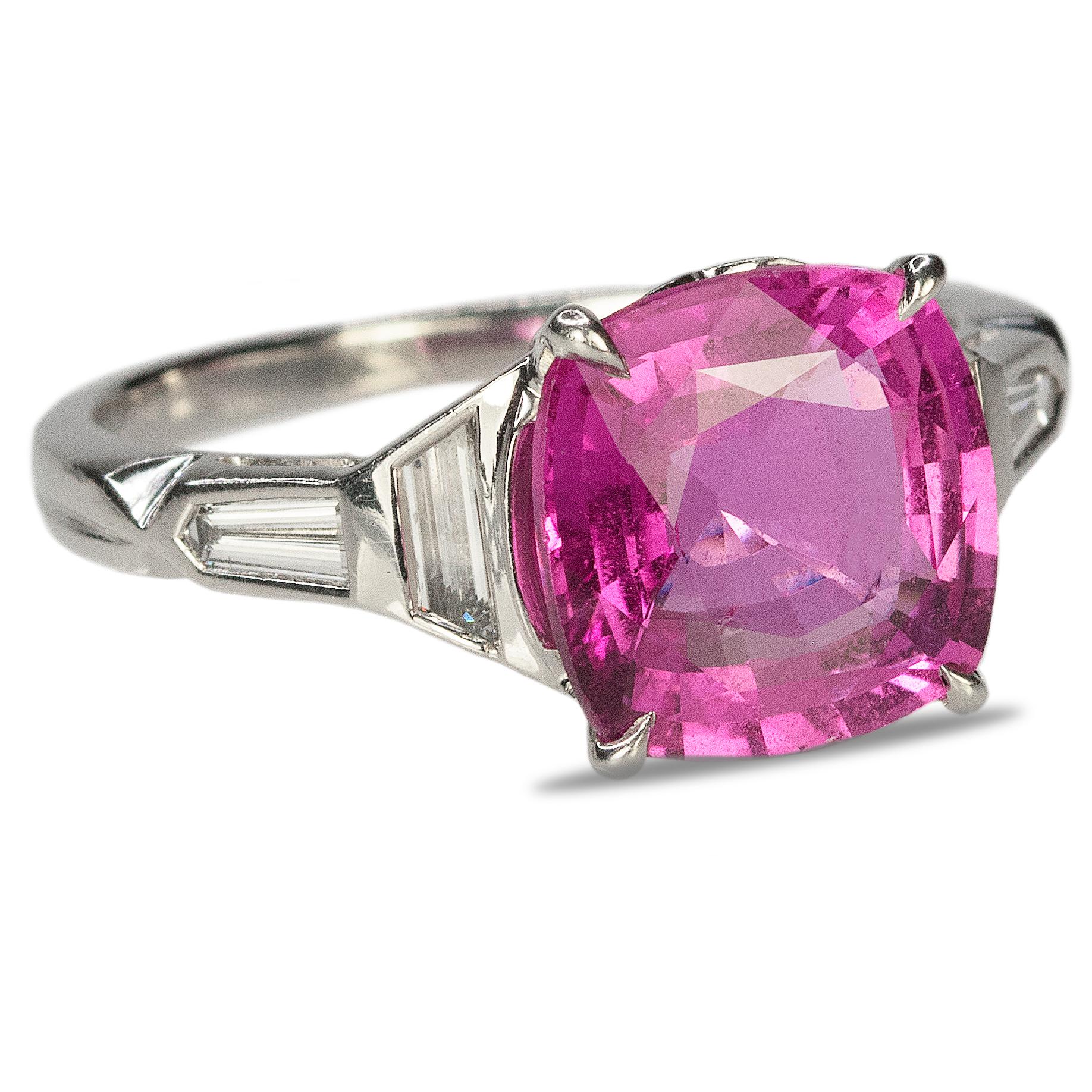 Platinum Art Deco ring with AGL certified 4.55 carat pink sapphire and 2 shield and two bullet cut diamonds weighing approximately 0.60 carats. 