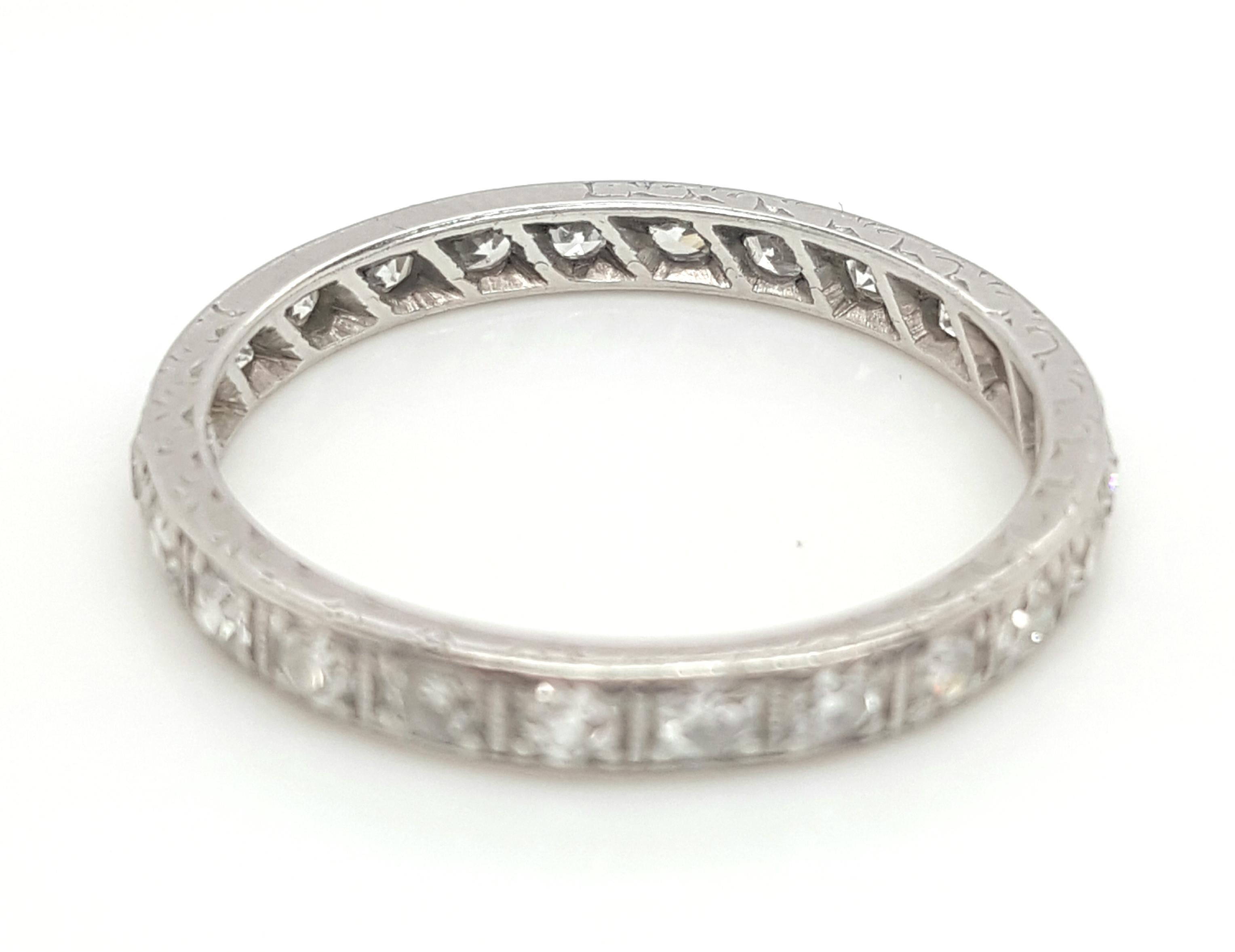 Platinum Art Deco eternity band set with Old Mine cut and full cut diamonds, weighing approximately 0.75 carats total weight VS2 - I1 clarity I - J in color.  This beautiful and detailed band dates back to the Art Deco era and will be the perfect