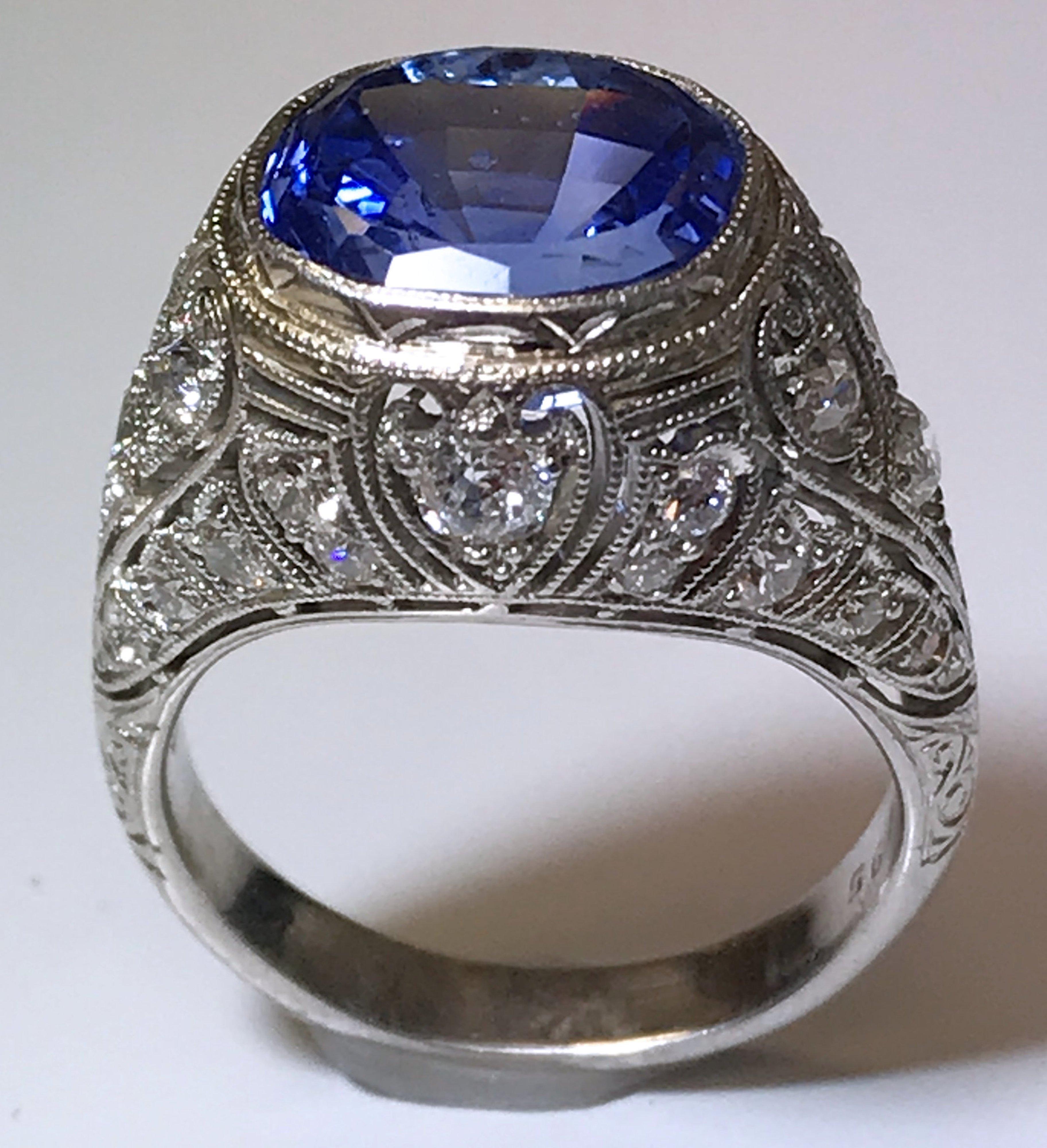Vintage Platinum Art Deco Sapphire and Diamond Ring, Oval Modified Brilliant Cut Sapphire 5.30 Carat; GIA Certificate #6177762559; No Heat, Ceylon;  European and Single Cut Diamonds 0.75 Carat Total Weight, VS-SI, G-H. Finger Size 6.5; Style Number