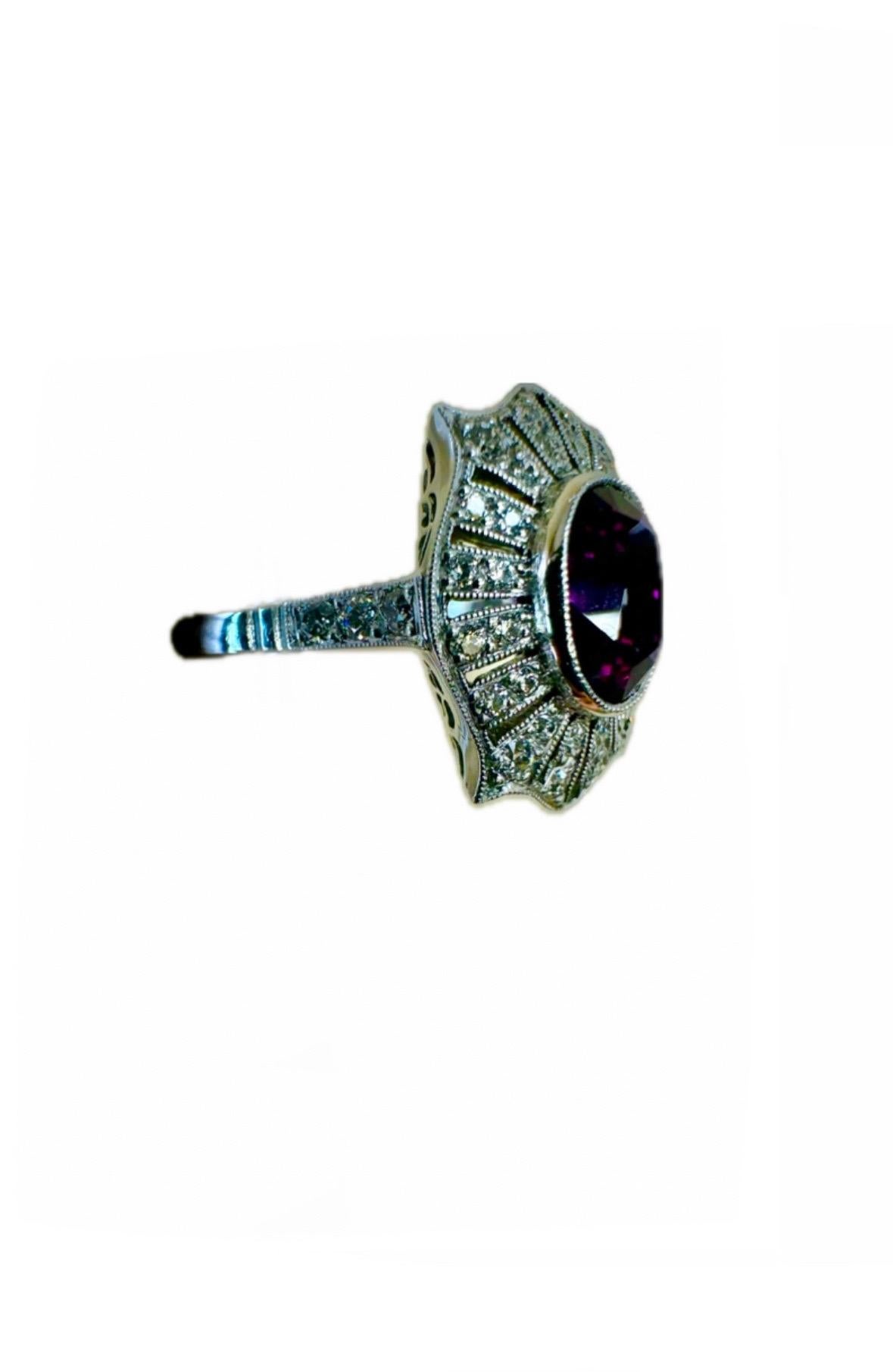 DeKara Designs Collection

Art Deco Inspired Extremely Elegant Handmade Vivid Purple Antique Style Diamond Engagement Ring.

Metal- 90% Platinum, 10% Iridium.

Stones- GIA Certified Oval Vivid Purple Sapphire 2.01 Carats, 38 Old European Cut Round