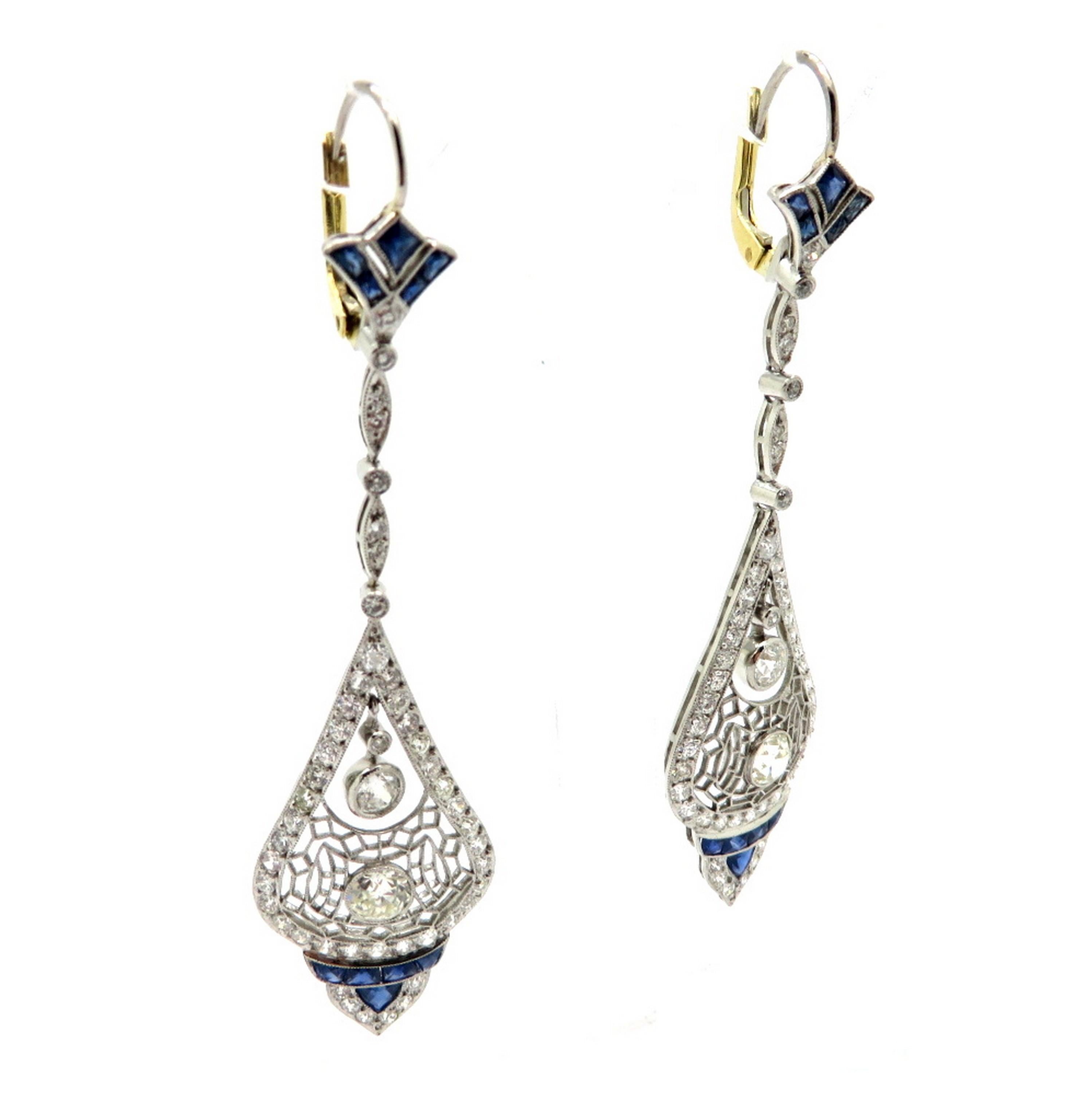 Estate platinum Art Deco style Old European cut diamond and sapphire platinum dangle earrings. Showcasing two Old European cut diamonds weighing a total of 0.40 carats, having H color grade and SI1 clarity grade. Interspersed with numerous Old