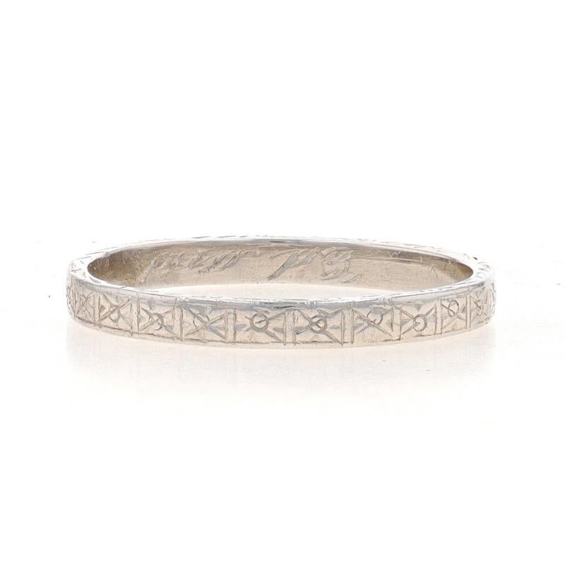 Size: 5 1/2

Era: Art Deco
Date: 1920s - 1930s

Metal Content: Platinum

Style: Wedding Band without Stones
Theme: Floral
Features: Etched Detailing Spanning the Entire Perimeter

Measurements
Face Height (north to south): 3/32