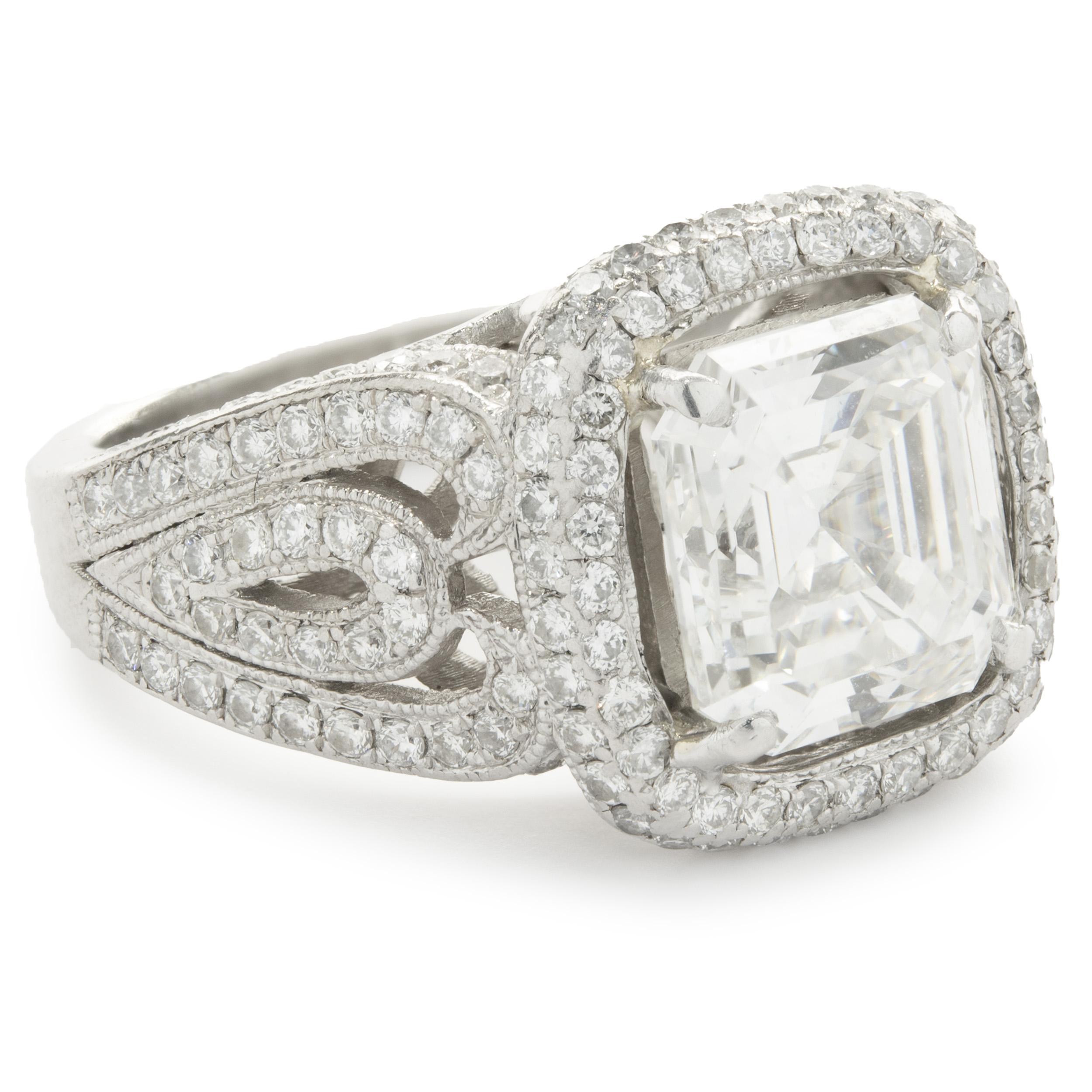 Designer: custom
Material: platinum
Diamond: 1 asscher cut = 2.50ct
Color: H
Clarity: VS1
Diamond: 128 round brilliant cut = 1.75cttw
Color: G
Clarity: VS1-2
Ring Size: 5 (please allow two additional shipping days for sizing requests)
Dimensions: