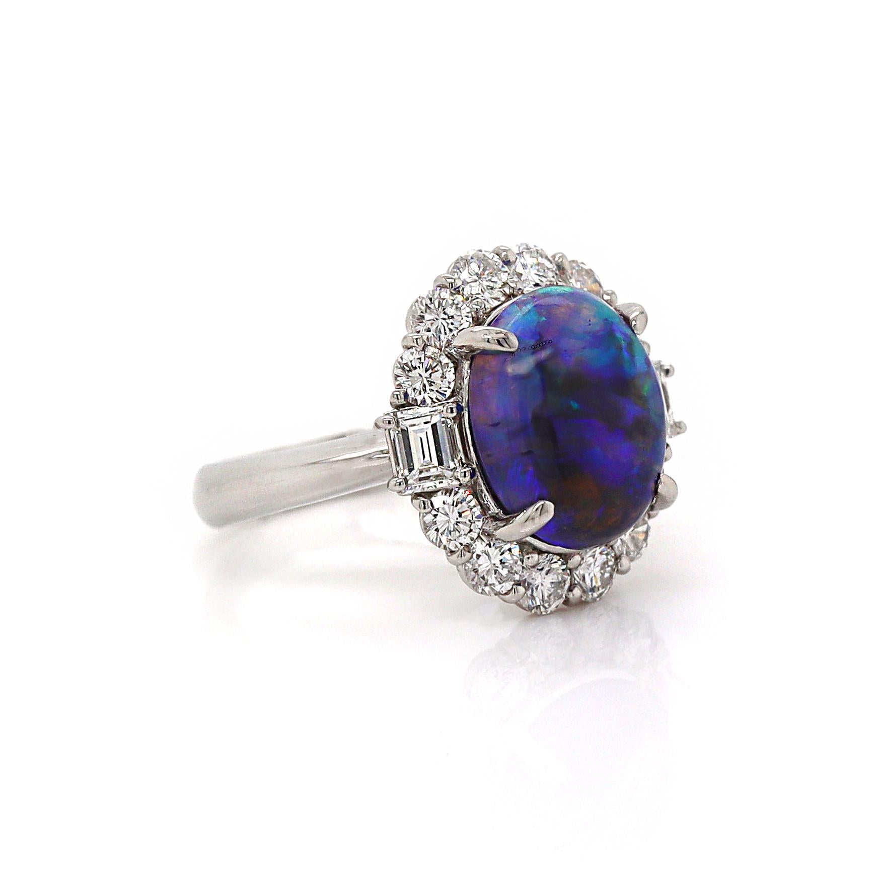 Platinum Australian Opal And Diamond Dress Ring

This exquisite dress ring features a central oval cabochon cut black Australian Opal from Lightning Ridge, with mesmerizing rich, deep black body color contrasted by a vibrant play of color in flecks