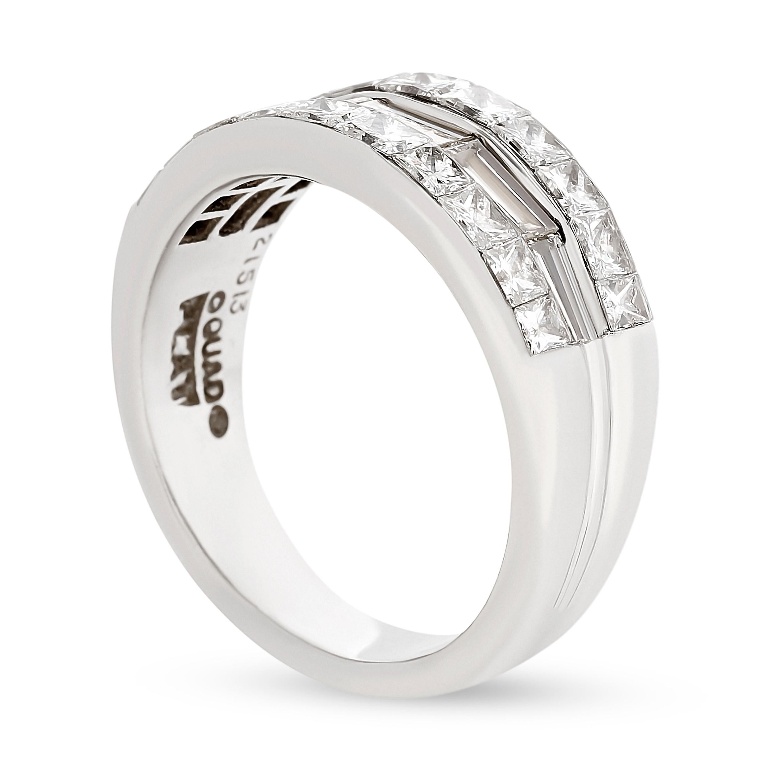 The band elegantly combines the sleek, elongated baguette diamonds with the brilliant, geometric princess cut diamonds.

This platinum diamond band features 5 baguette diamonds with 20 baguette diamonds. Total, there is approximately 2.24 carat. The