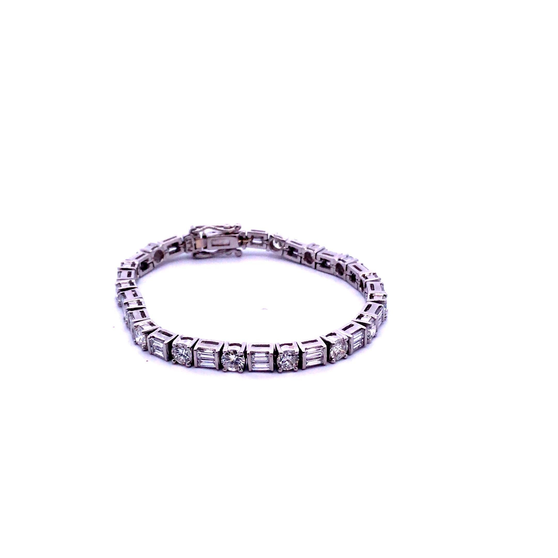 Lady’s Platinum Bracelet weighing 30.4 grams, 6.50 inches in Length and 0.16 inches in width. The Bracelet is set with Round and Baguette Brilliant Cut diamond weighing 9.00 carats having a Color Grade of: F-G, Clarity Grade of: SI-1 / SI-2 and