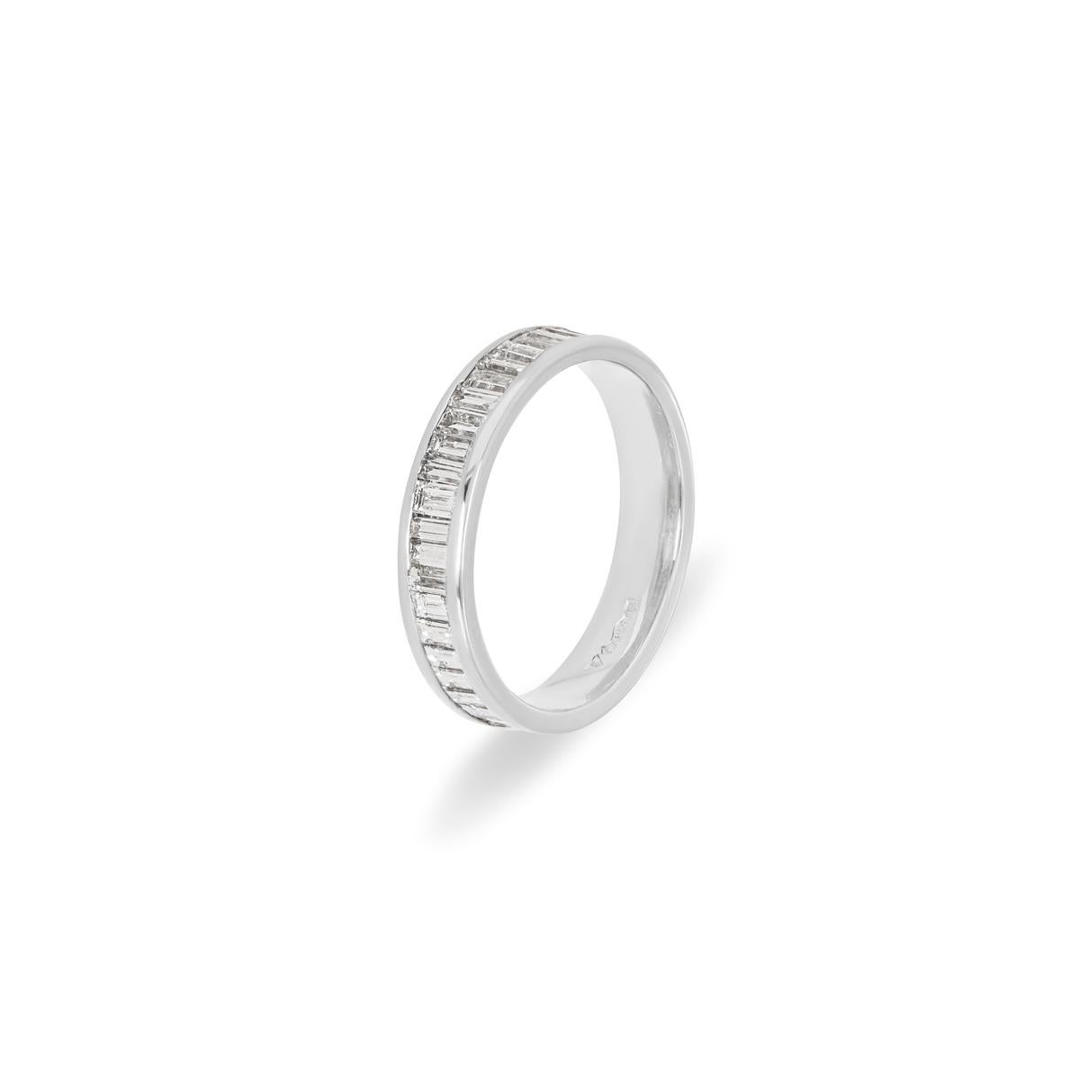 A timeless platinum diamond half eternity ring. The band is set to the centre with 32 baguette cut diamonds in a channel setting with an approximate weight of 1.12ct, G-H colour and VS clarity. The 4mm ring has a gross weight of 4.93 grams and is