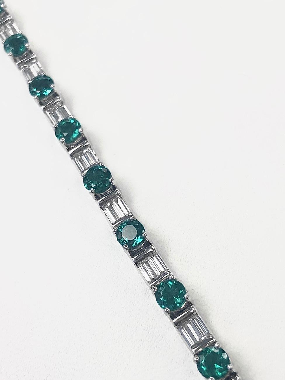 Women's Platinum Baguette Diamond and Fine Emerald Line Bracelet For Sale